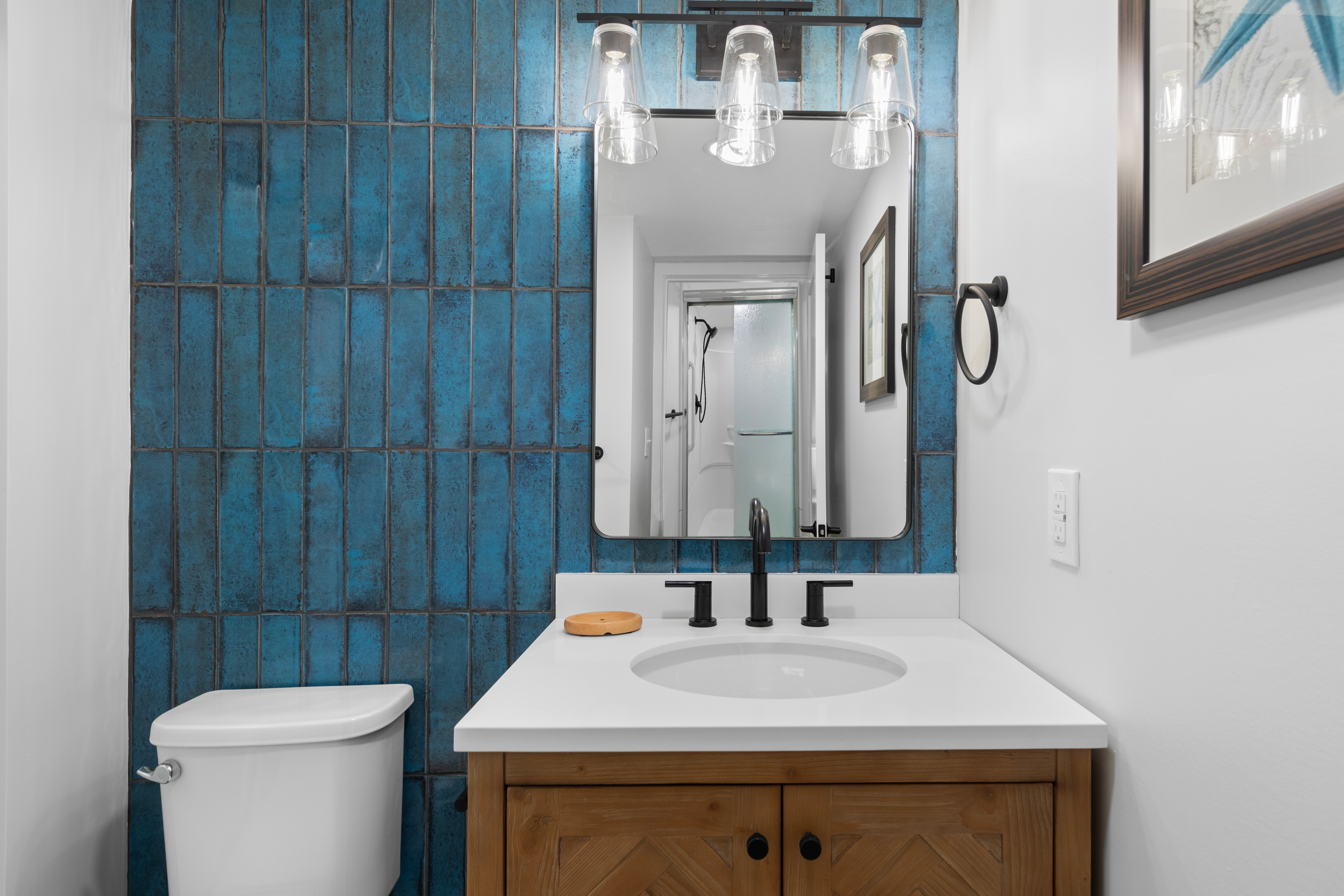 The Attached Primary Bath Has a Beautiful Blue Backsplash!