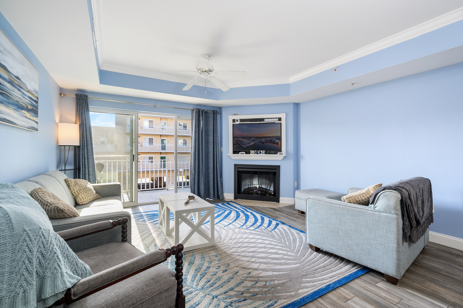 There is plenty of seating to relax and watch a movie or play a boardgame together in this lovely living room. *Fireplace is decorative only*