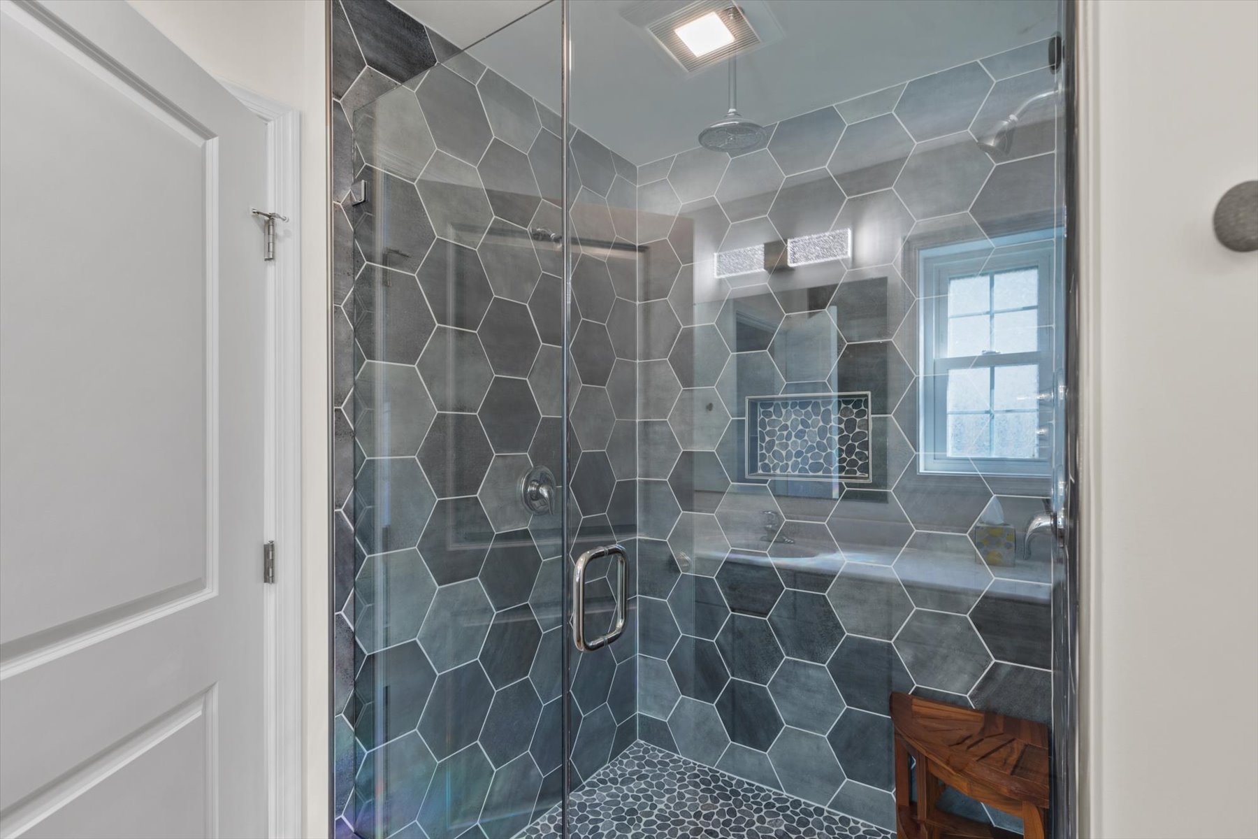 Custom Walk-in Shower has Dual Shower Heads and a Rainfall Shower.