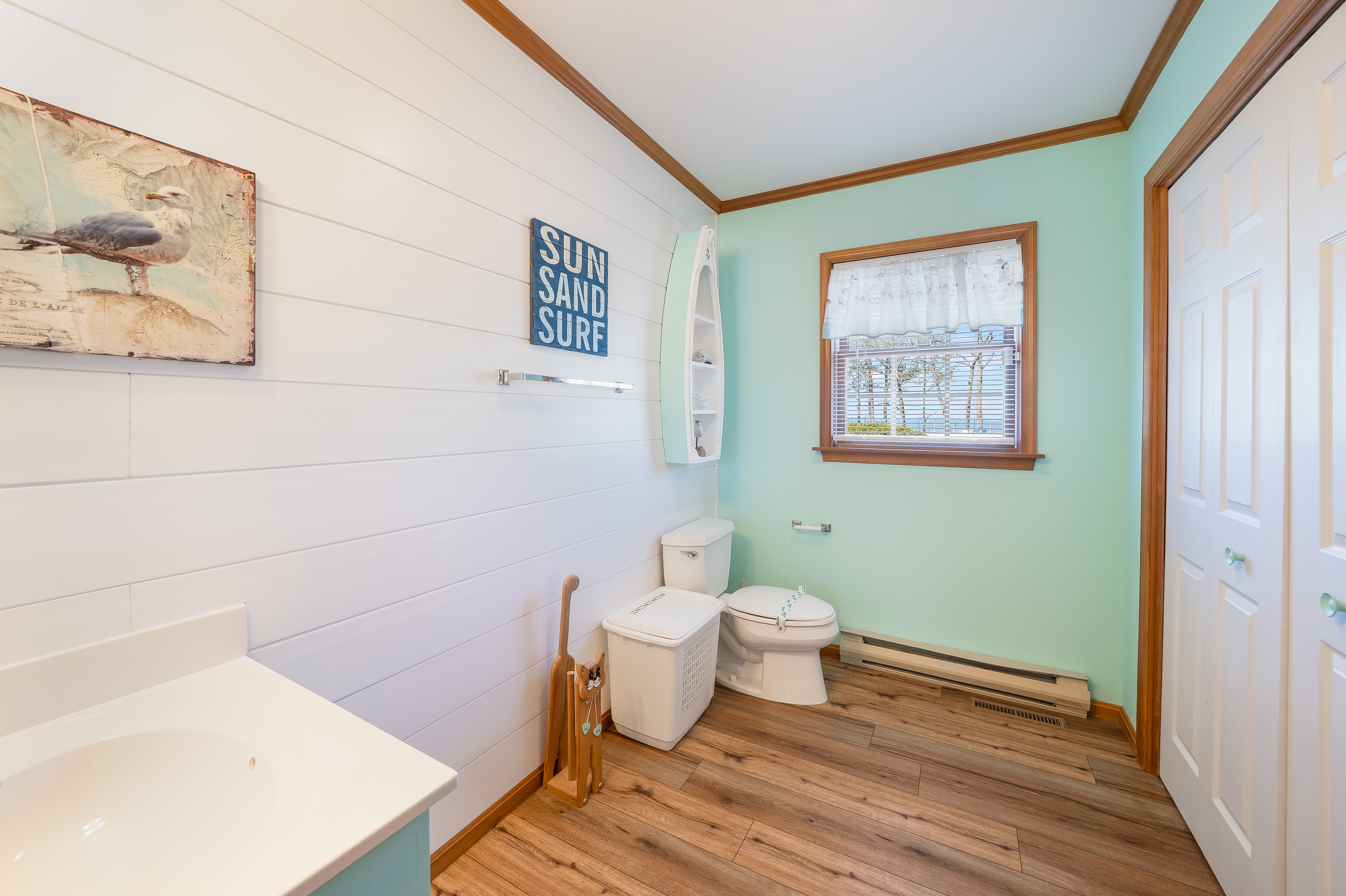 1st Floor Half Bath just around the corner from the Kitchen