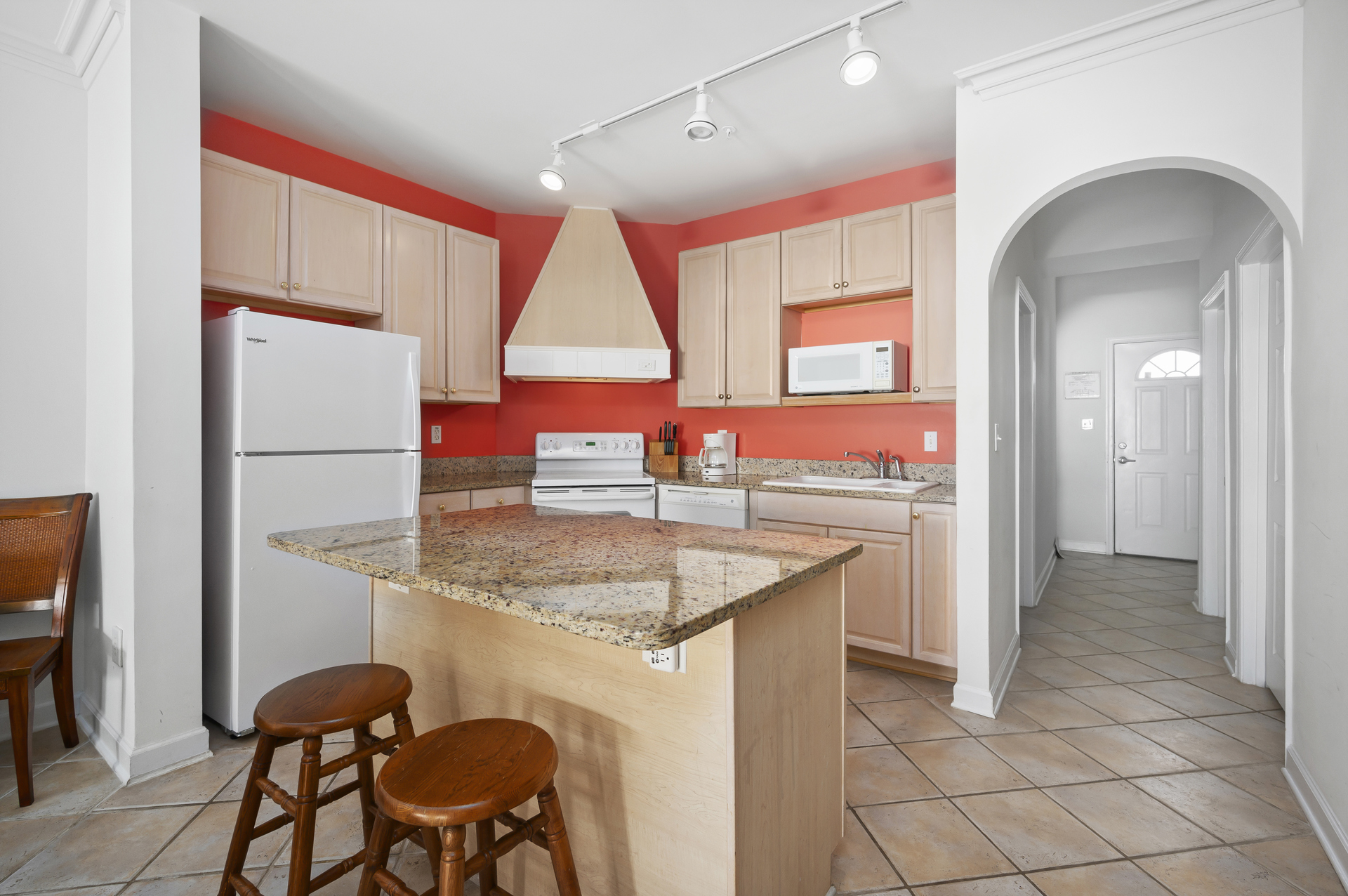 There is no lack of counter space here, there is even seating at the island