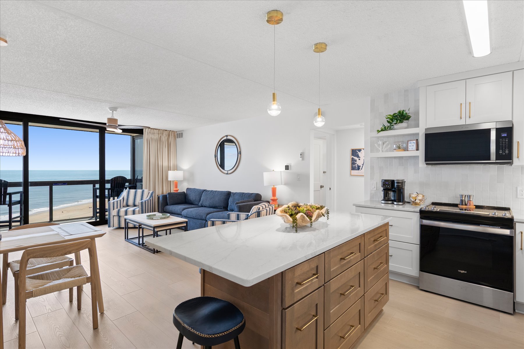 Clean and modern with white countertops and wood cabinets.