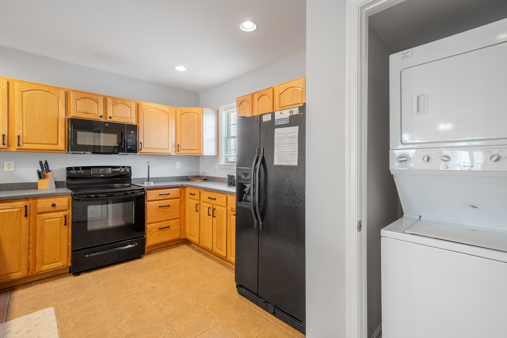 Right off the Kitchen is a stacked Washer/Dryer for your use!