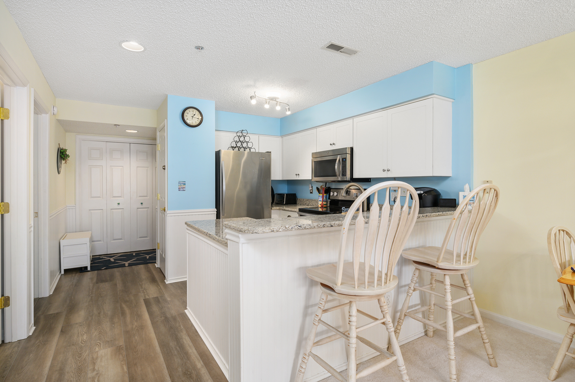 Bright & Beachy Kitchen with floors reminiscent of the famous OC Boardwalk!