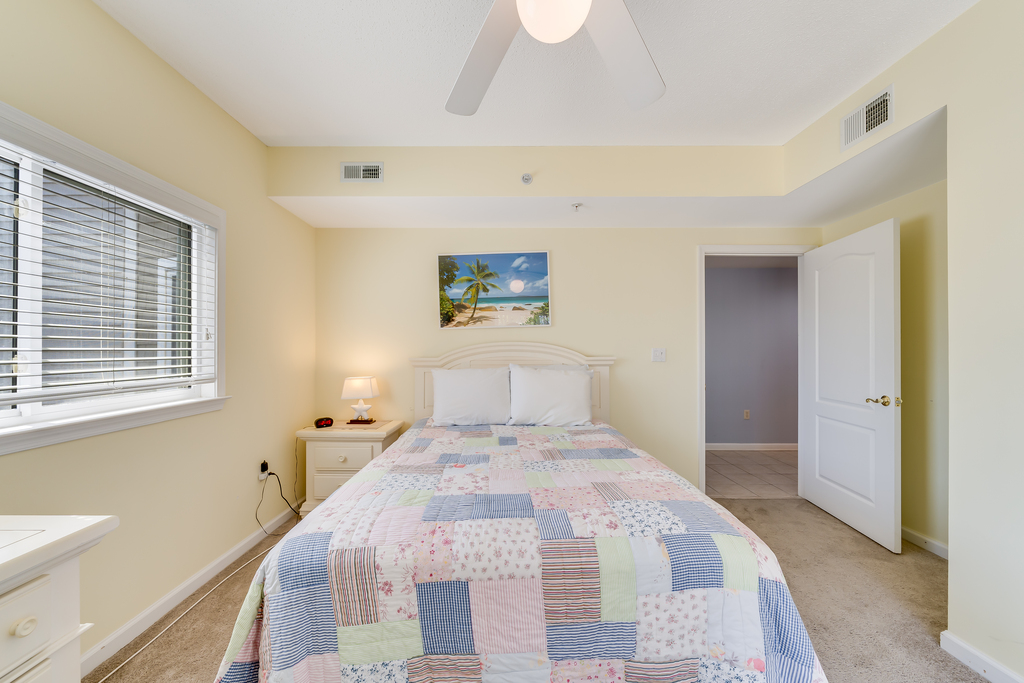 Bedroom 3 has a Queen Bed and access to the Balcony.