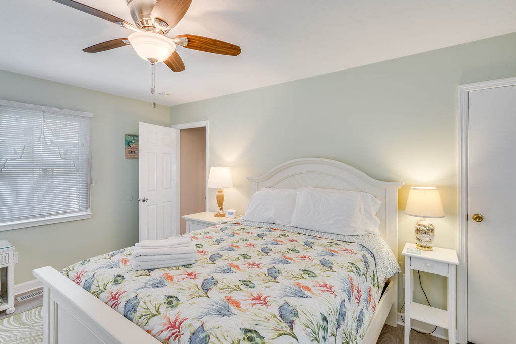 Bedroom 3 has another Queen Bed and colorful accents.
