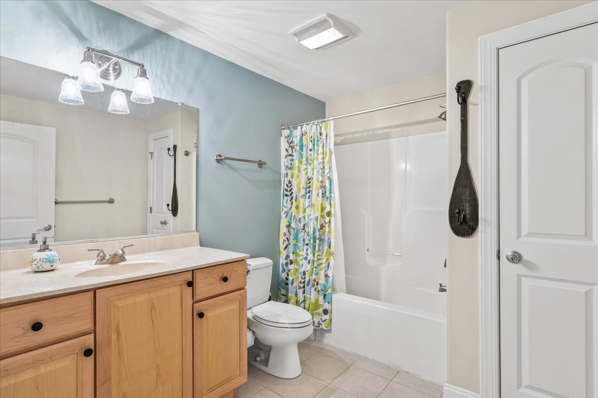 A Shared Full Bath with Tub/Shower Combo is convenient to Bedrooms and Living Area.