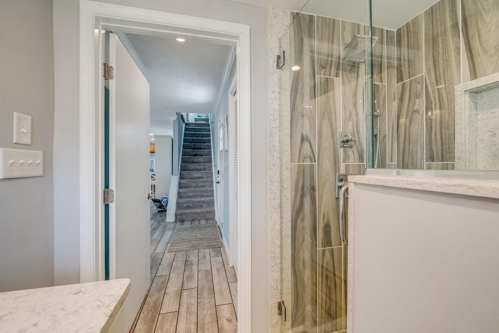This bathroom is nothing short of a spa-like retreat with a spacious glass walk-in shower.