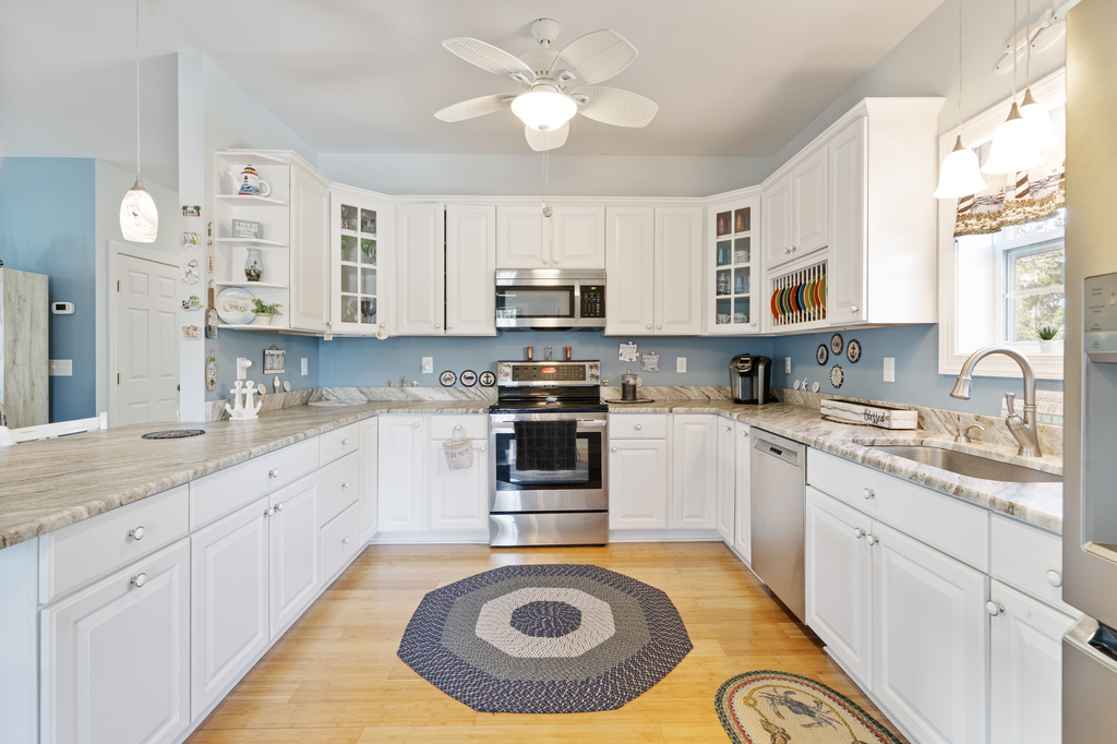 Beachy White Cabinetry and Stainless Appliances in the Chef's Kitchen.