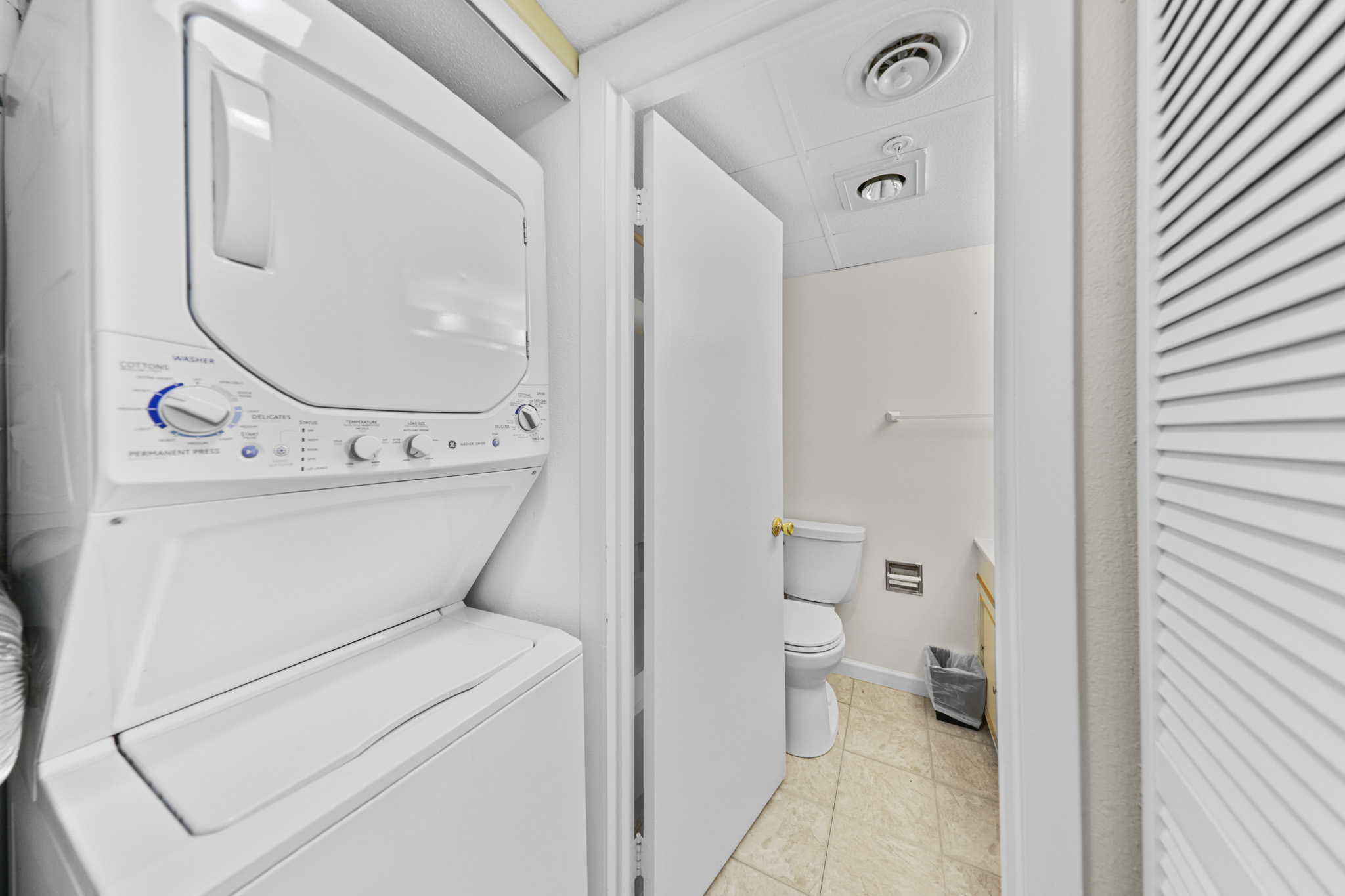 Stacked Washer and Dryer in the Hall for your Convenience.