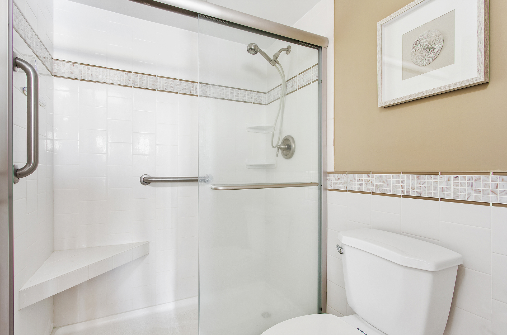 Freshen up from the days of fun in the sun in this Custom Tile, Walk-In Shower!