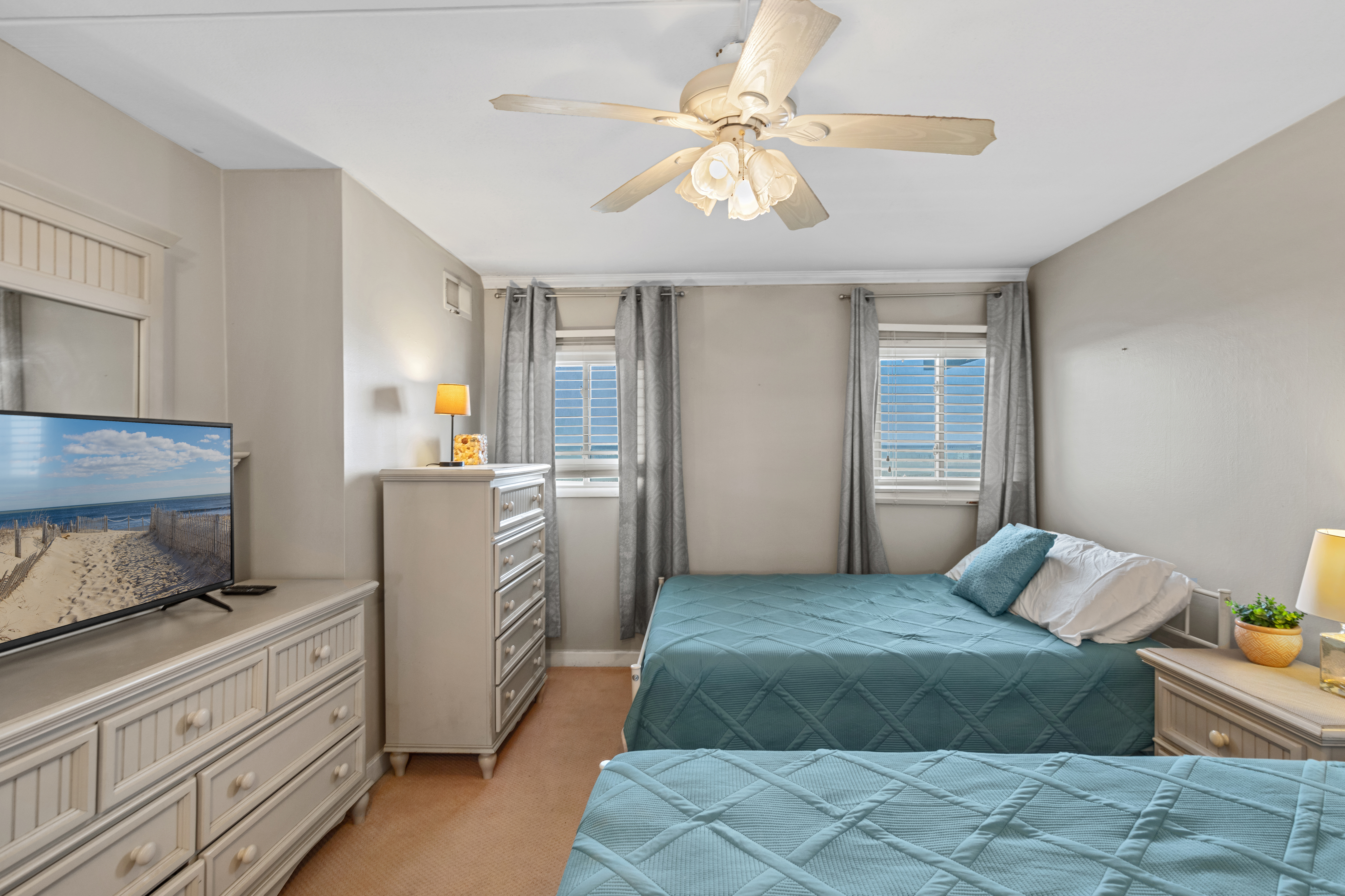 The Bedroom features 2 Queen Beds.