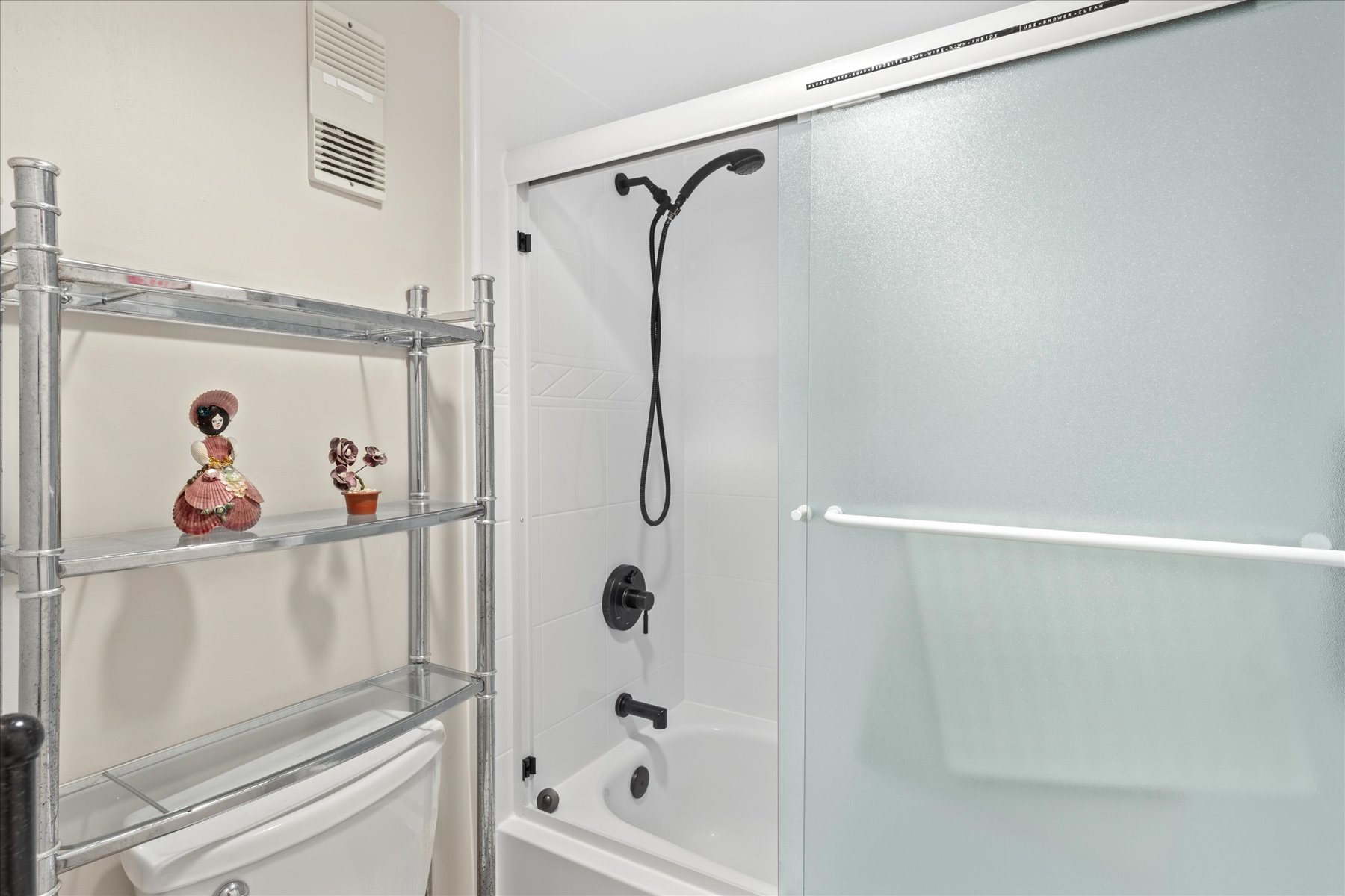 Features a Shower/Tub Combo.