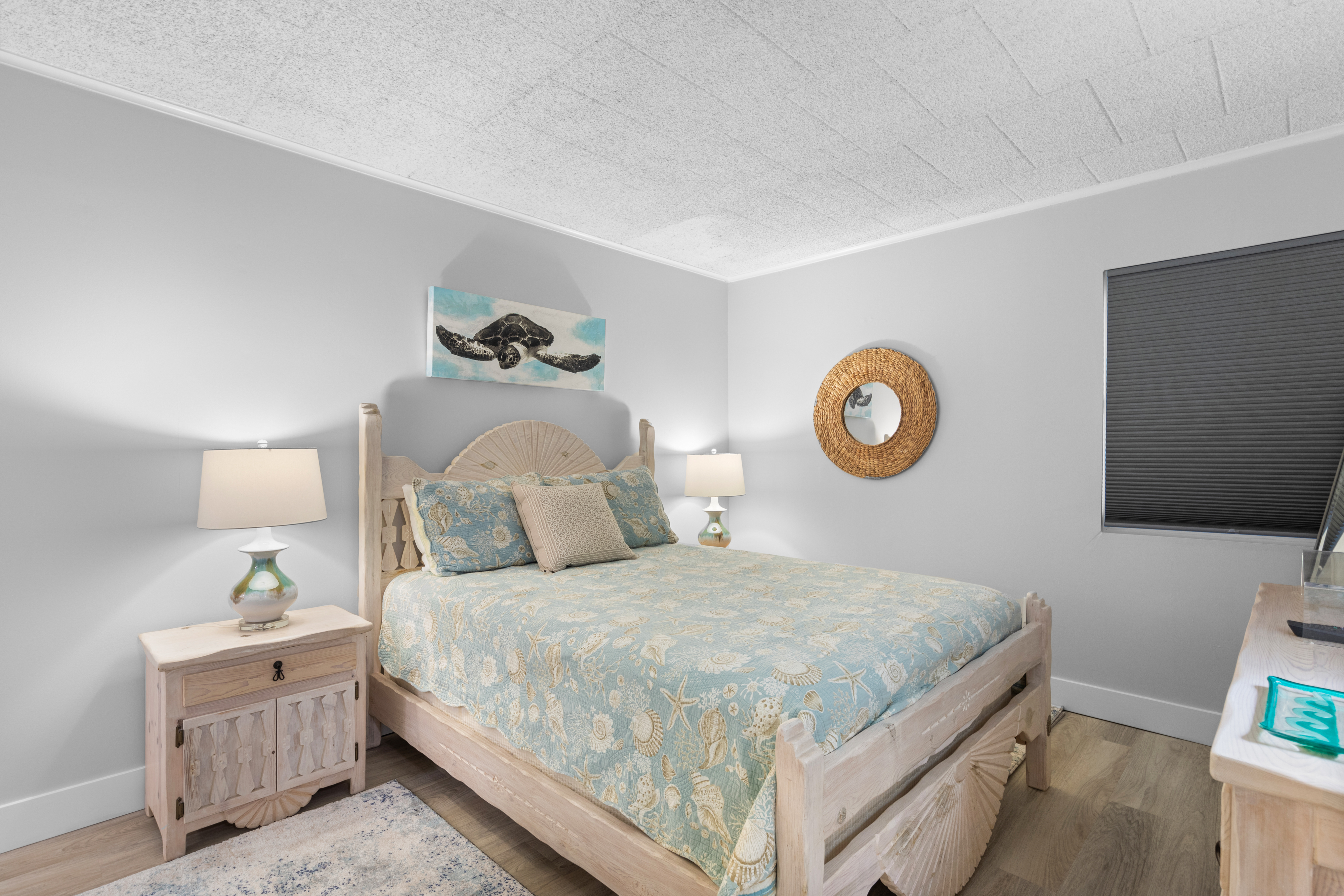 The serene Primary Bedroom has a comfy Queen Bed