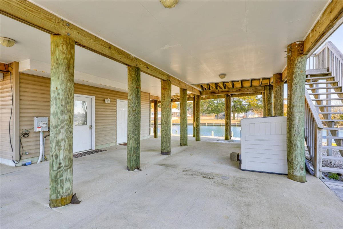 Room under the house for beach chairs and water toys.