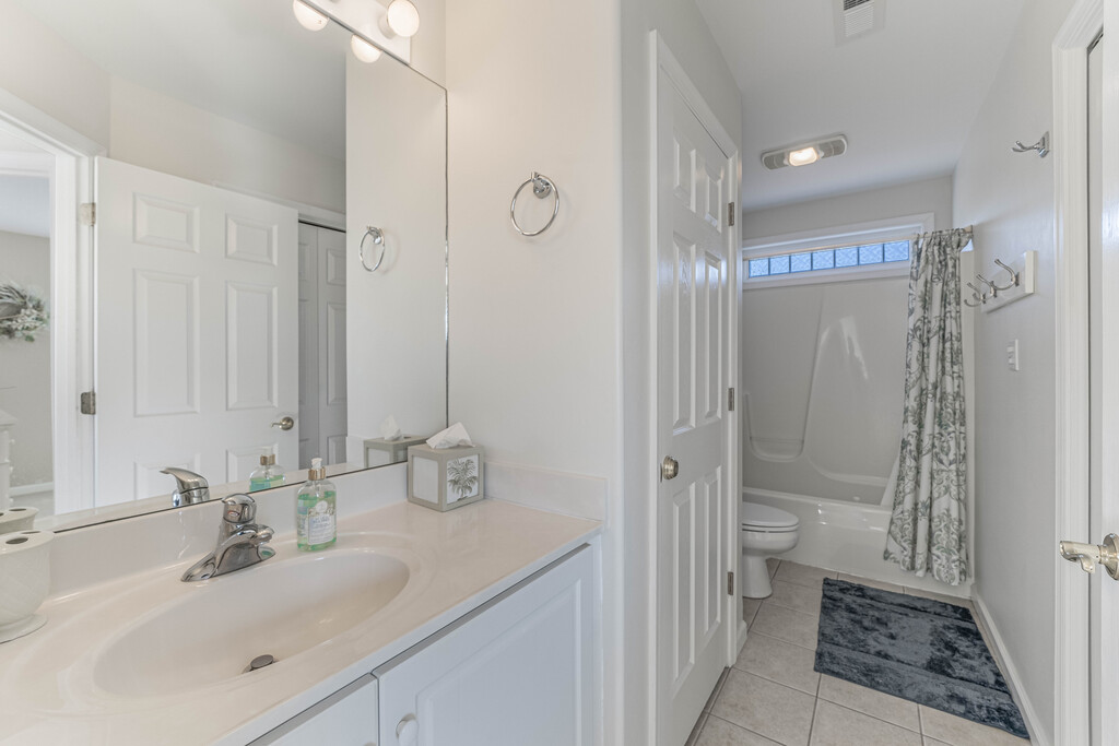 Full Bath 2, upstairs, is shared and has a Tub/Shower Combo.