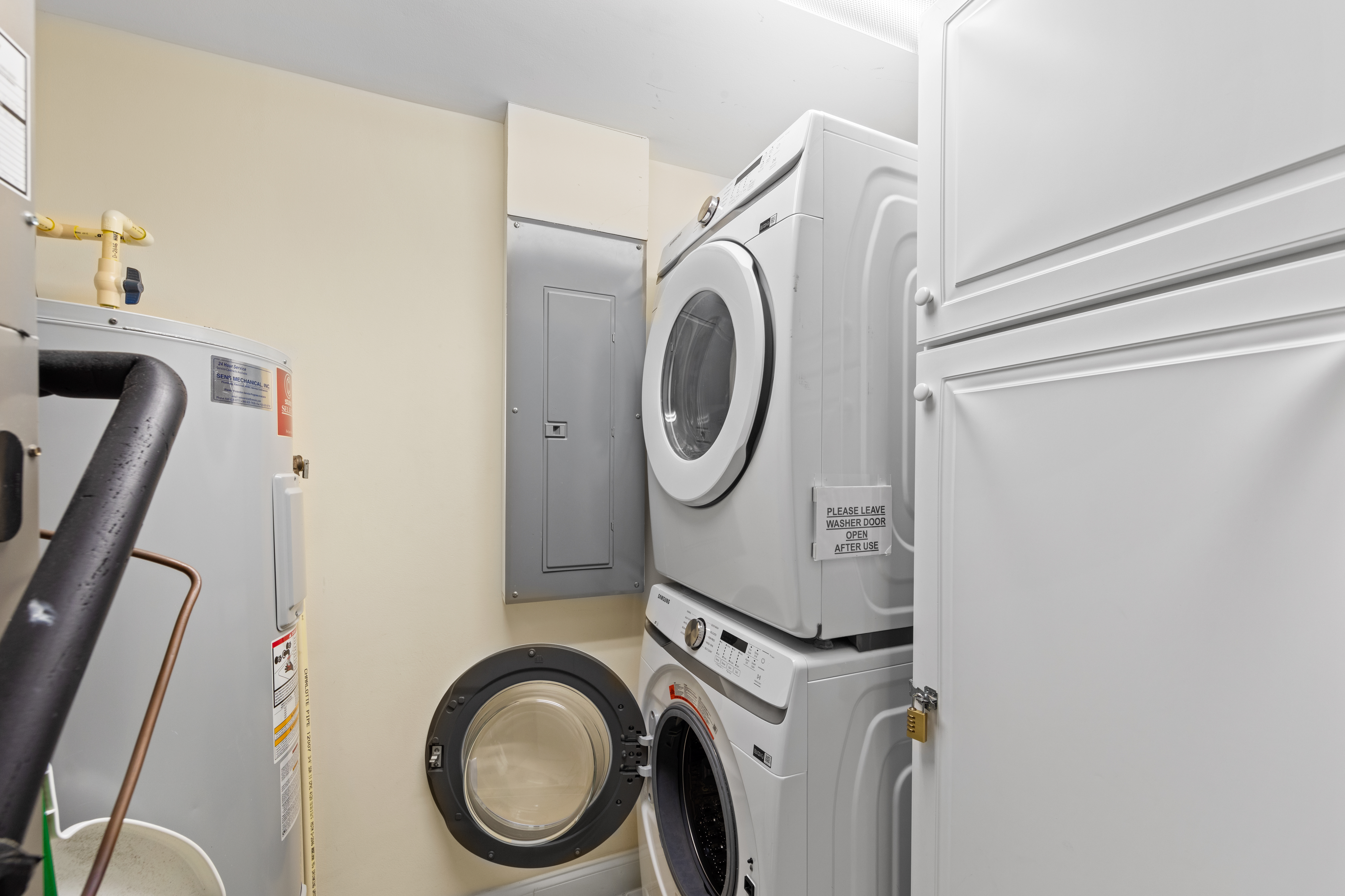 And laundry room with full size Washer and Dryer.