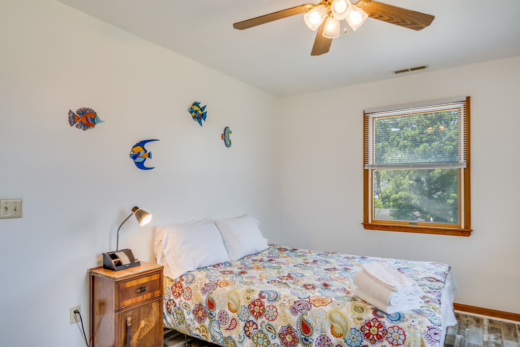 Bedroom 2 is sunny & cheerful, and has a Queen Bed.