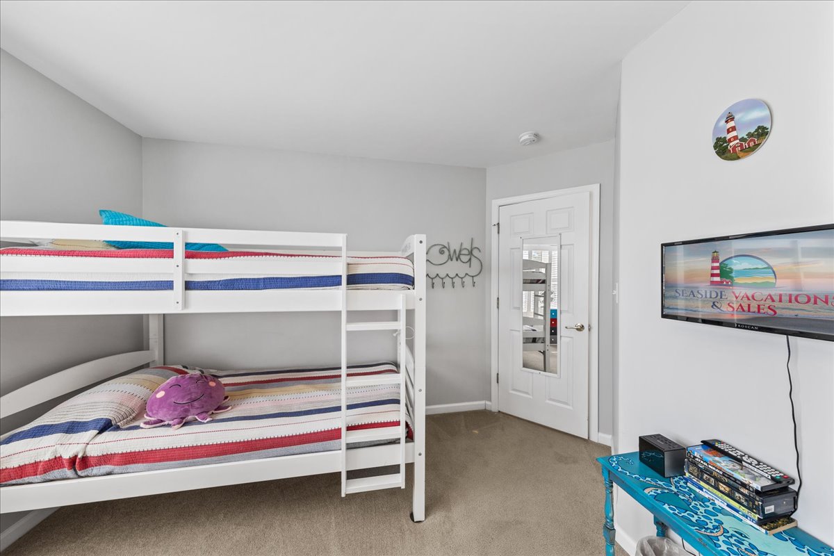 Bedroom 3 sleeps 4, and is bright and cheerful.