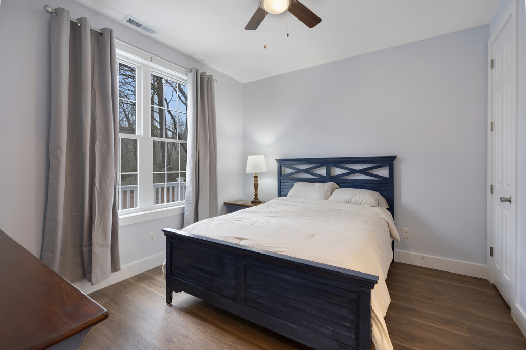 Bedroom 1 has a comfy Queen Bed and Private Access to Full Bath 1.