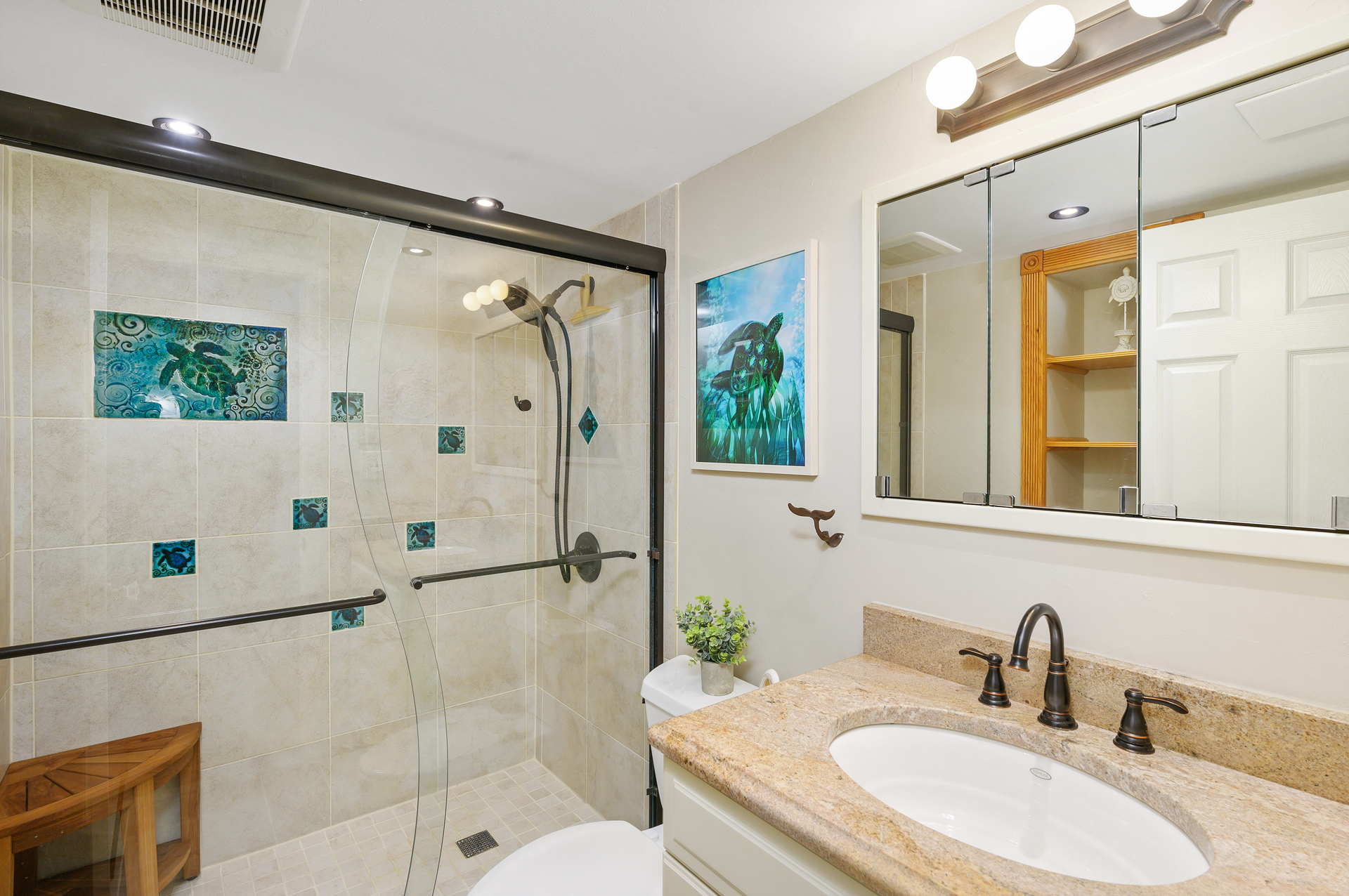 Shared 2nd Bath is pure elegance with a Custom Tile Shower and a fun Sea Turtle theme!