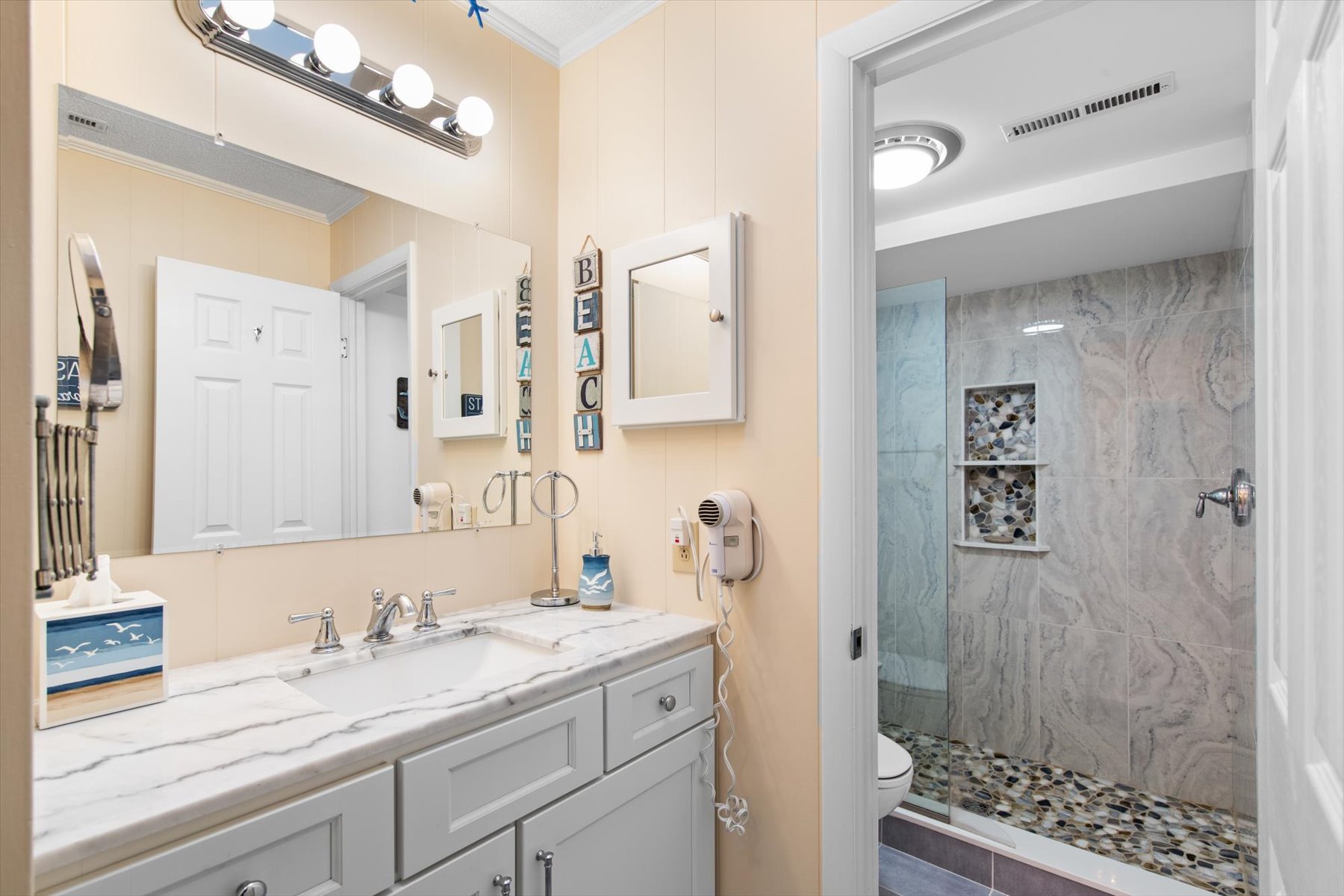 Freshen up in the Primary Bath with custom Walk-in Shower
