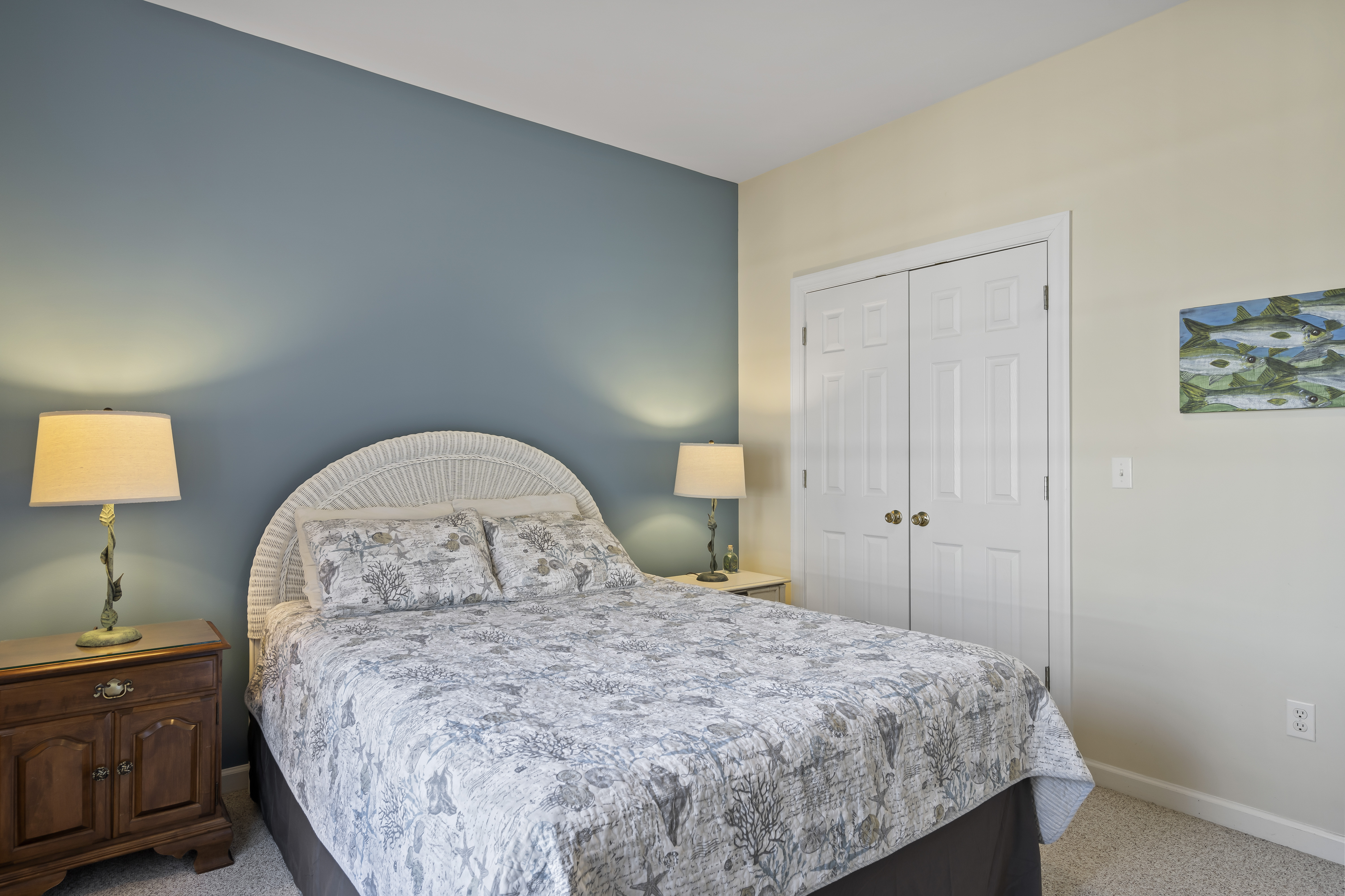 Spacious Bedroom 1 has a large closet & Coastal Decor.
