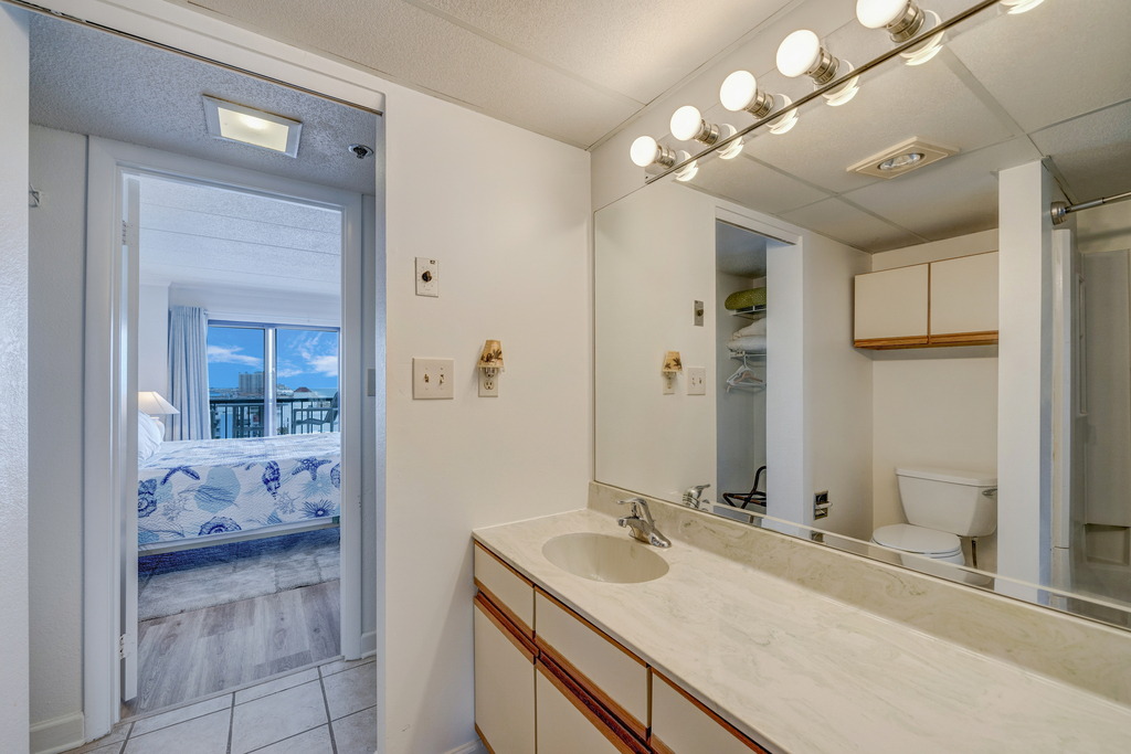 The Primary Bedroom shares a Jack and Jill bath that’s brightly lit and equipped with spacious counterspace