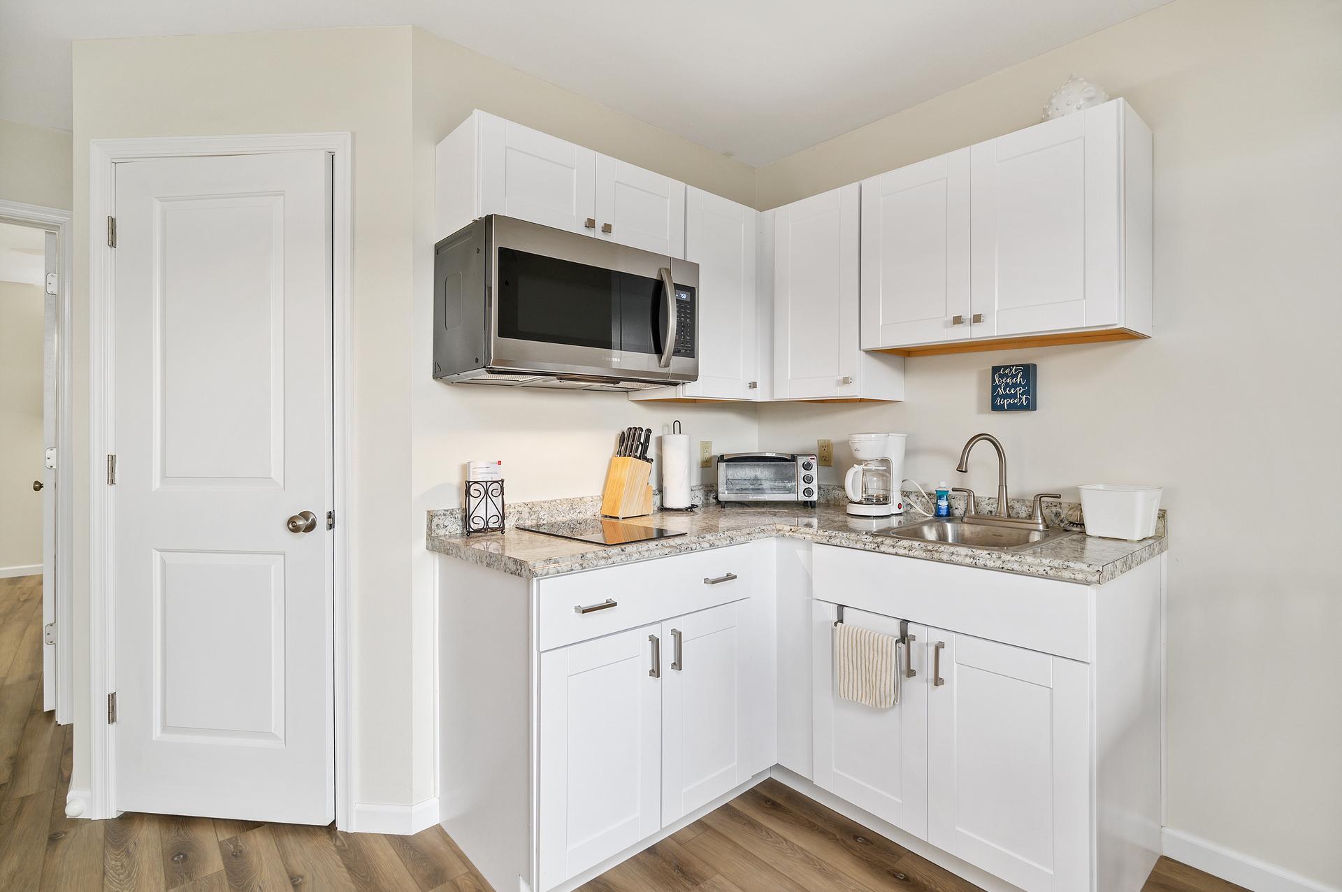 Microwave, 2 Burner Cooktop, Toaster Oven, and Coffee Maker.