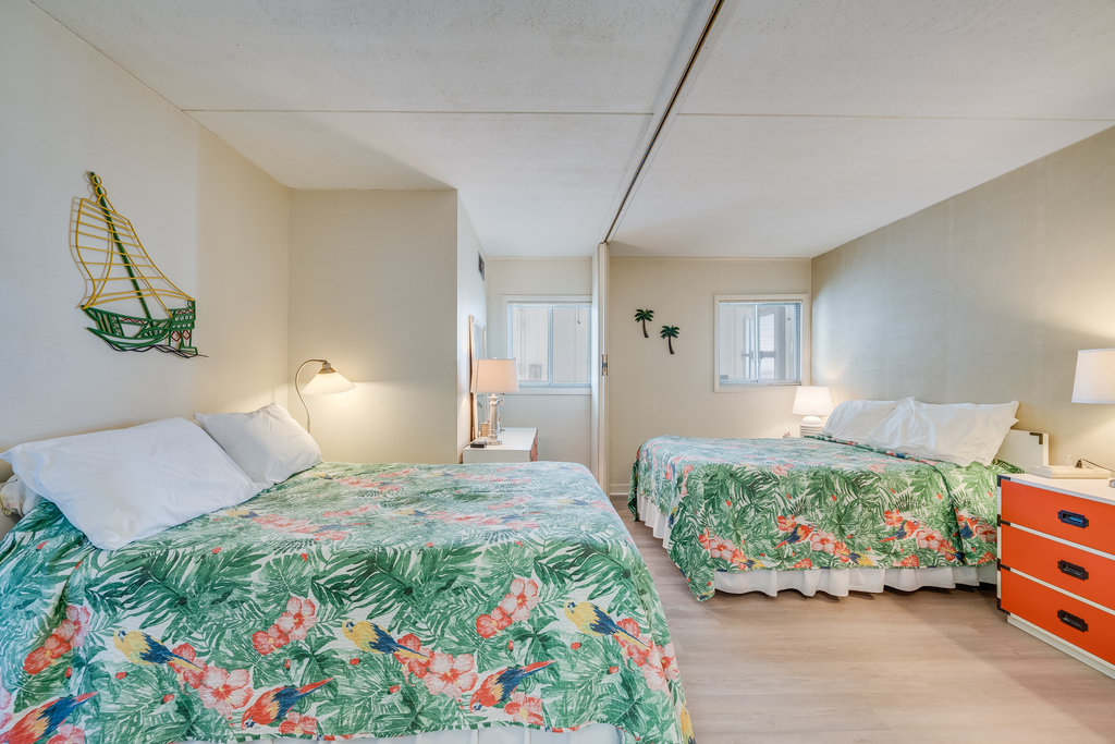 The Bedroom offers 2 Plush Queen Beds.