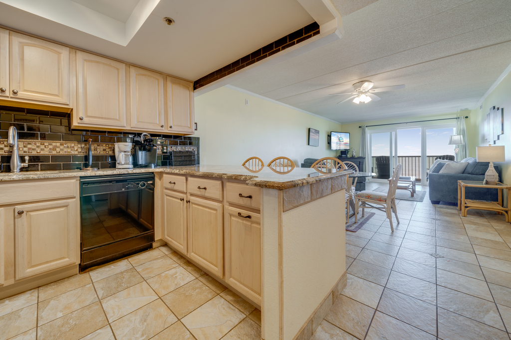 Kitchen has gleaming Granite and gorgeous Custom Backsplash.