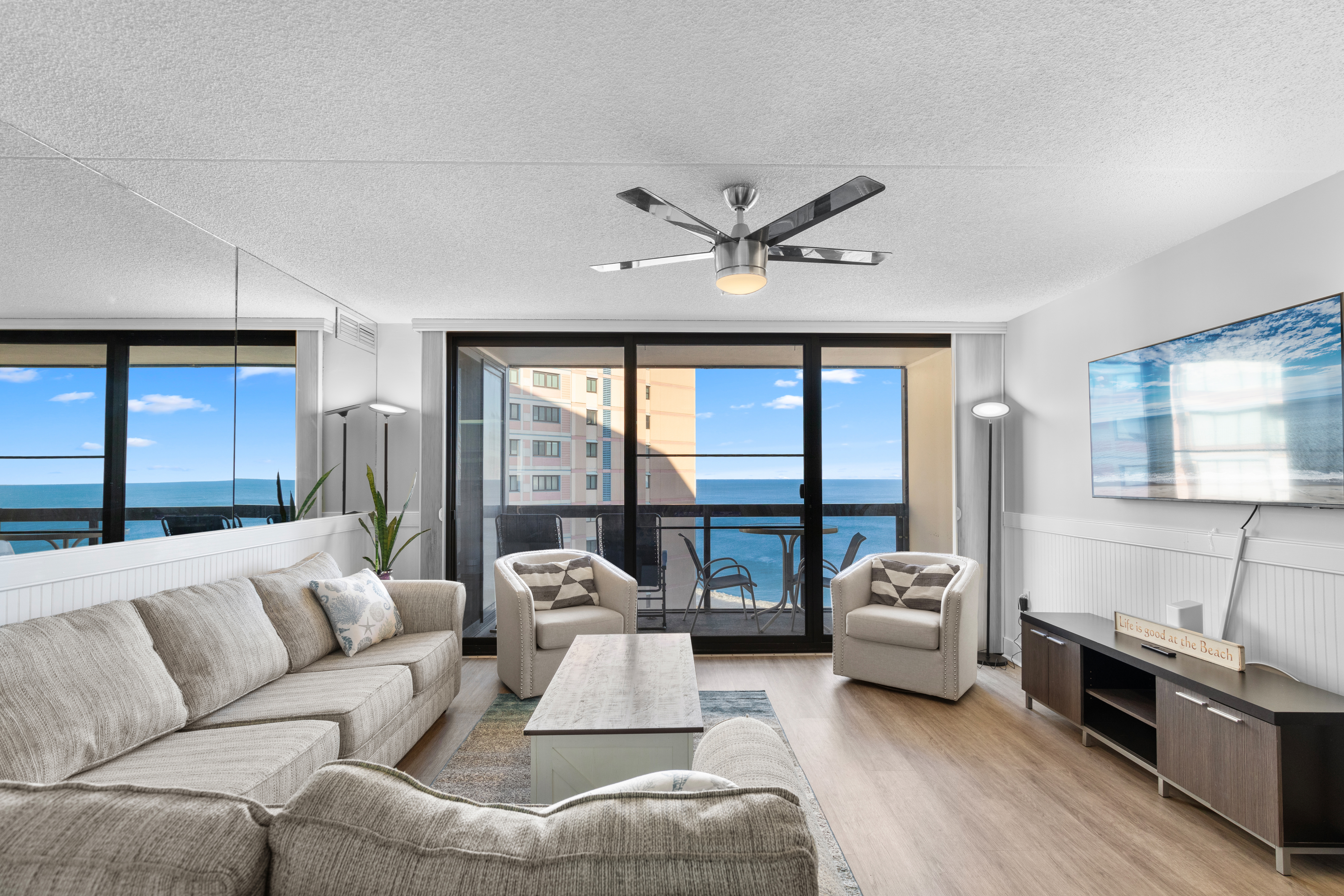 There is plenty of seating in the living room for the whole family to gather 'round.