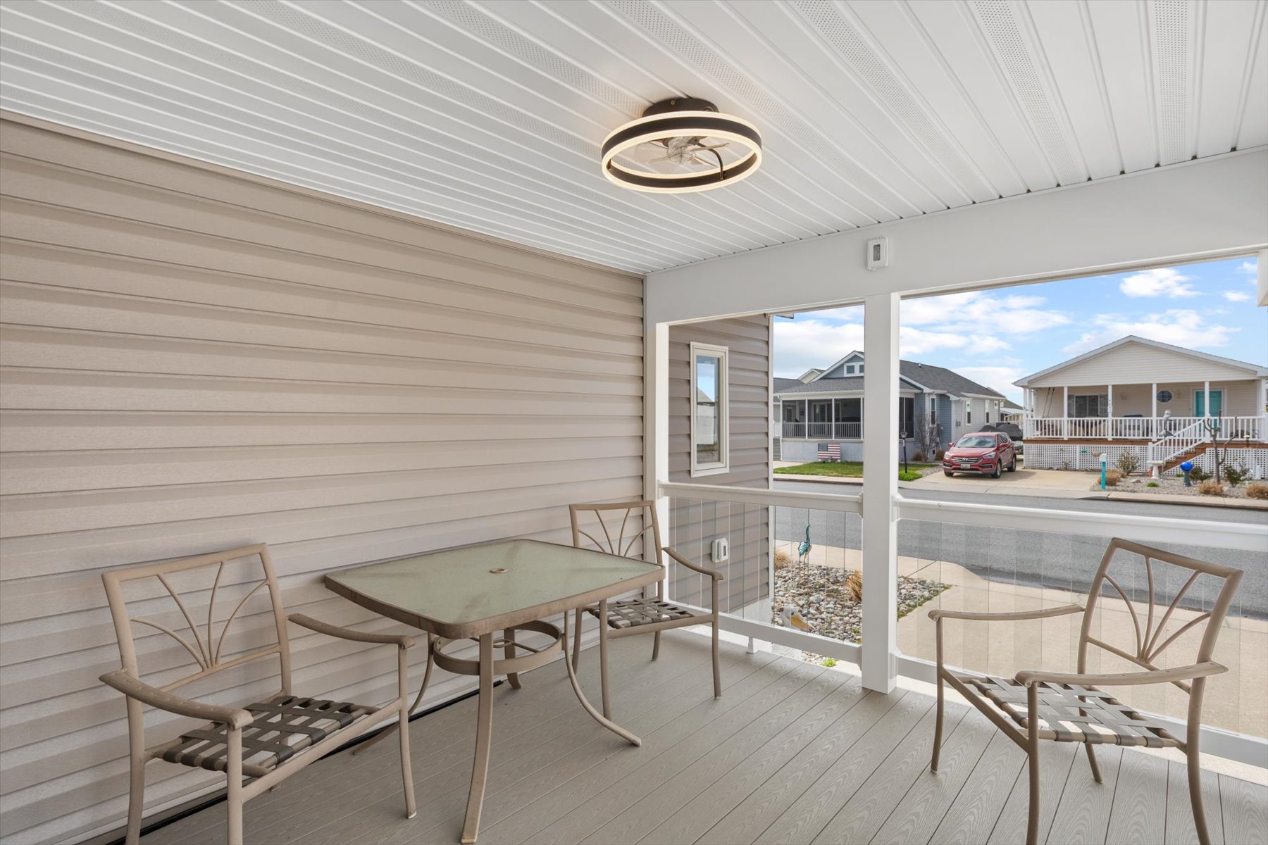 Screened porch with plenty of seating.