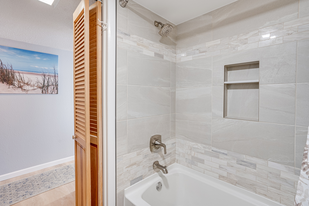 There is a Shower/Tub combo in Bathroom 2