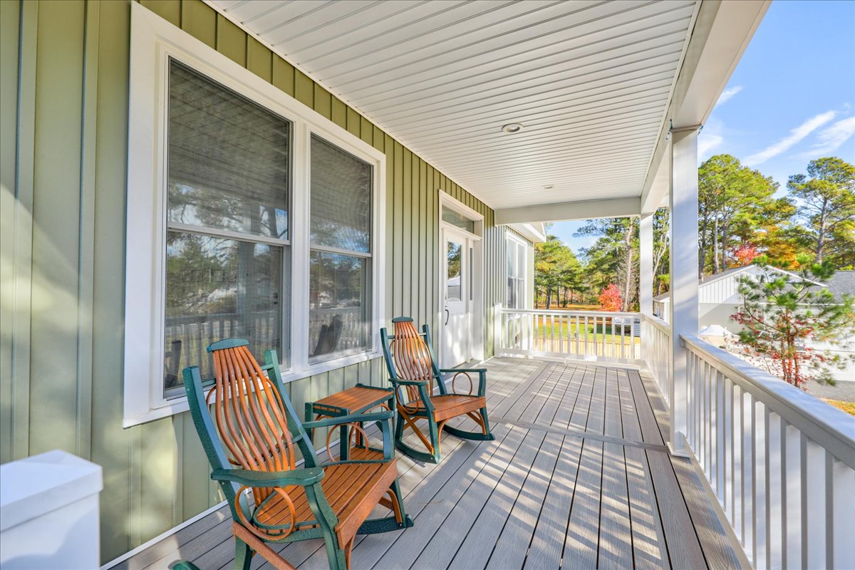 Sit back on the Covered Porch and listen to the Tree Frogs sing.