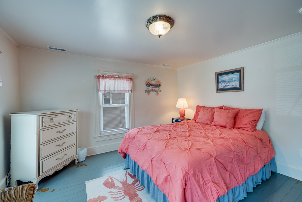 Bedroom 2 has another Queen Bed and cheerful colors.