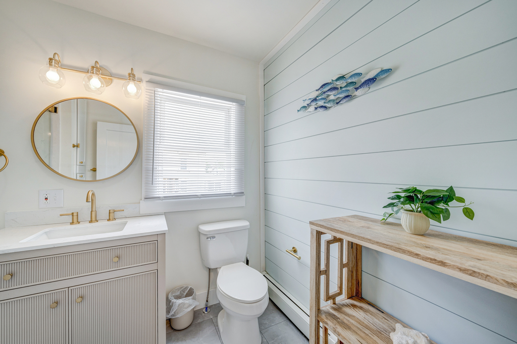 Coastal Shiplap and beachy decor are warm and welcoming.