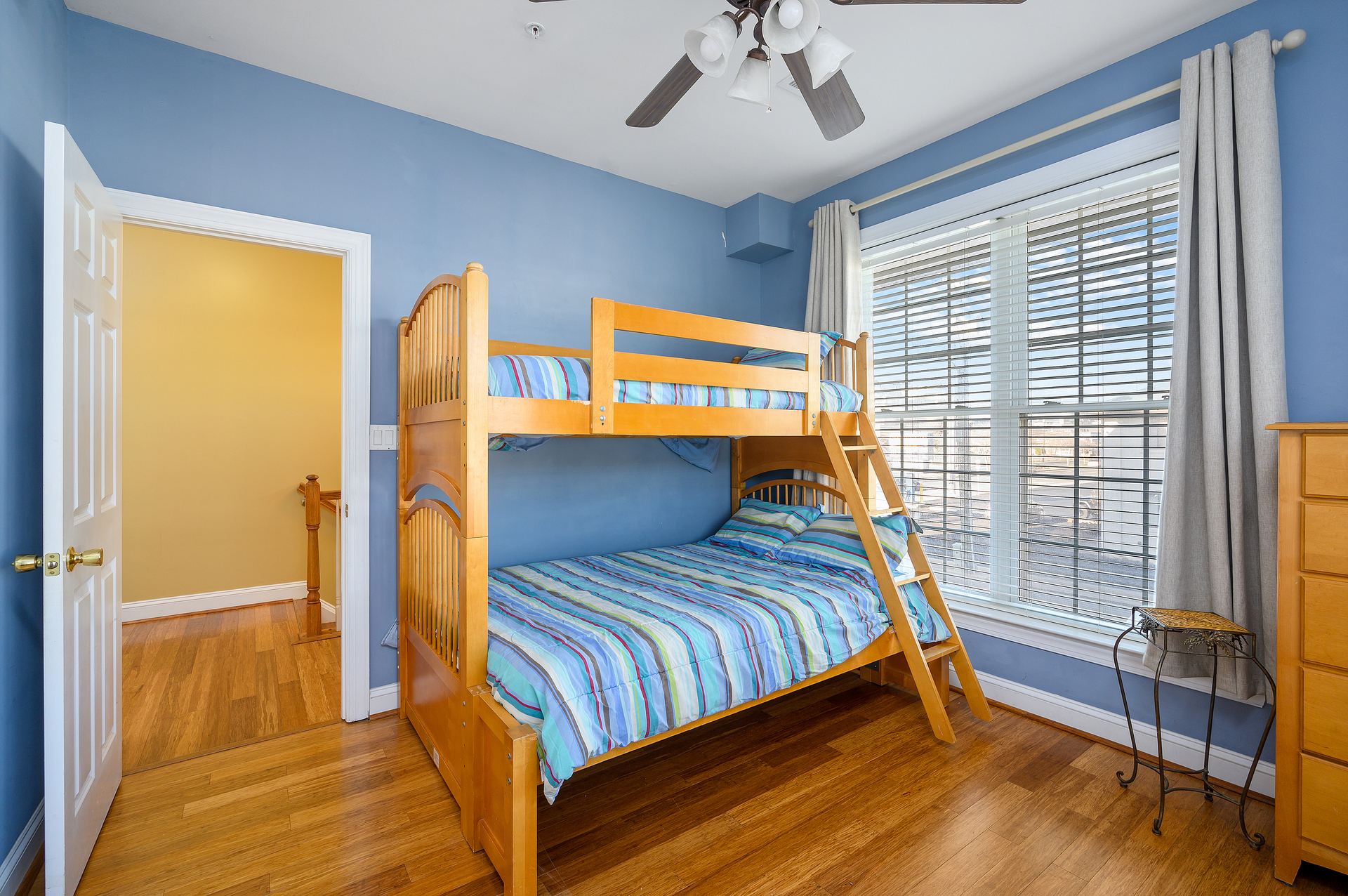 Bedroom 3 will make your kids want to go to sleep in this Pyramid Bunk Bed after a long day at the beach