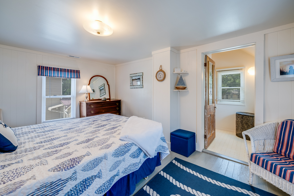 Bedroom 1 is the Primary Bedroom, with a Queen Bed and Attached Full Bath.