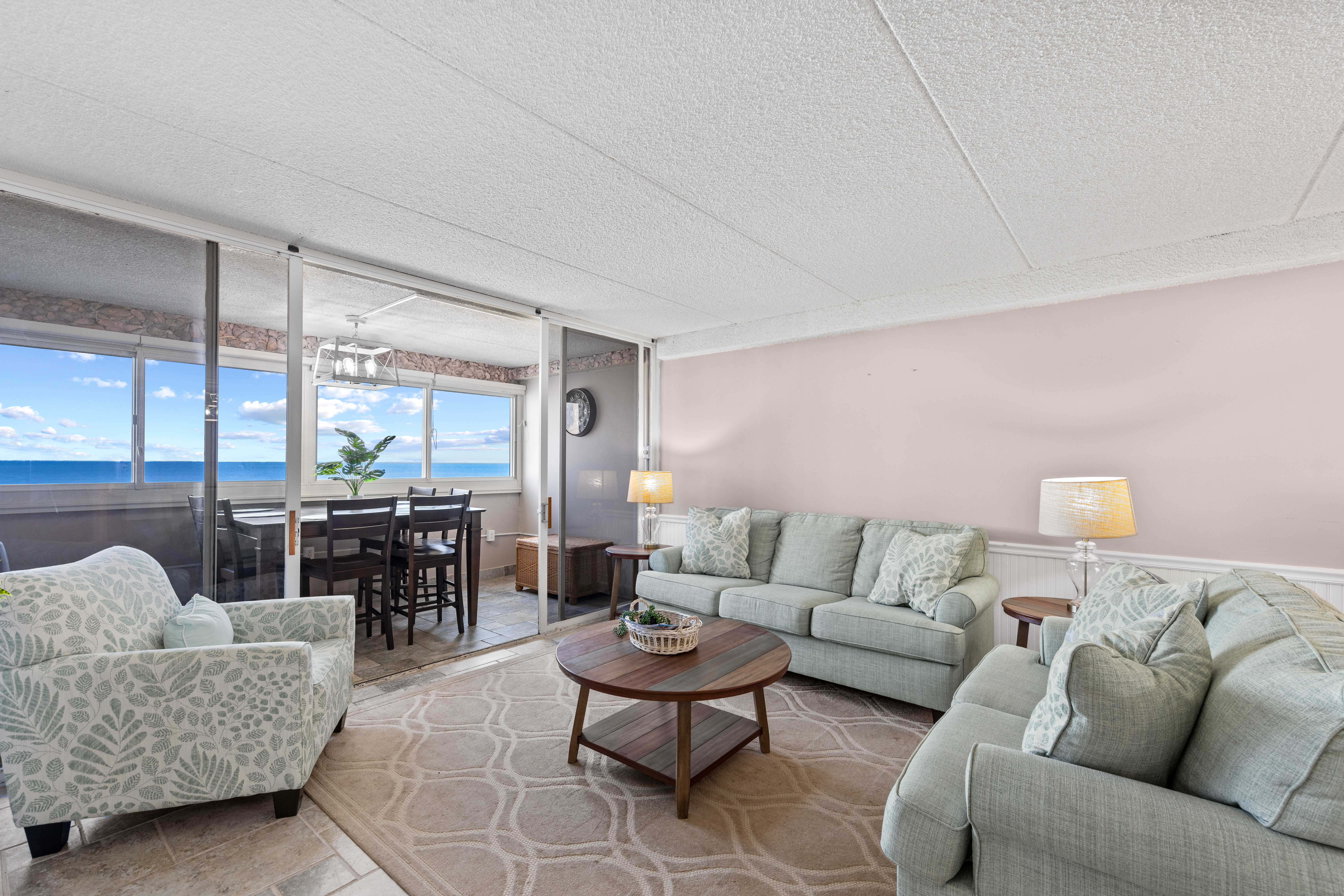 Just off to the side, discover the charming enclosed balcony!