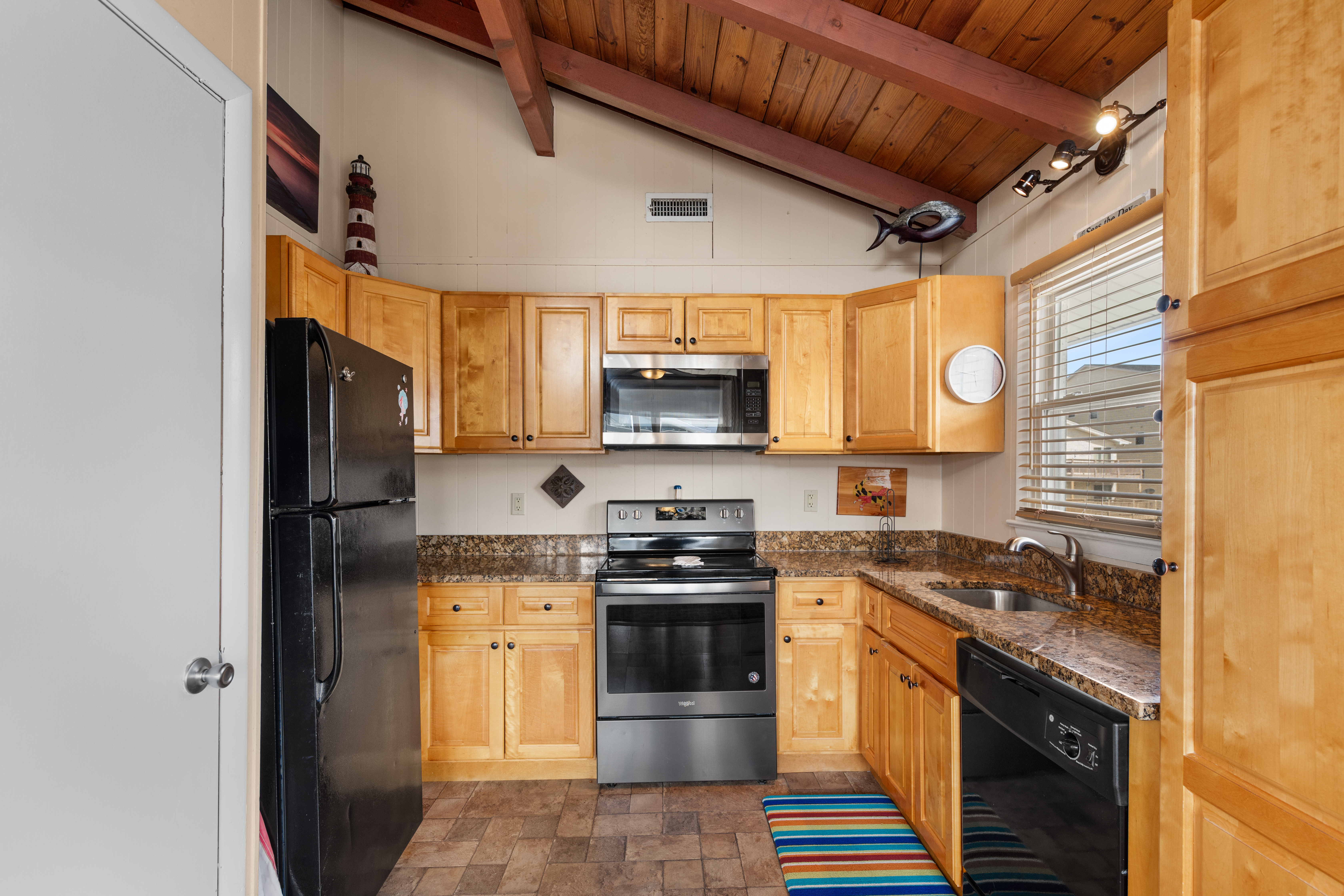 Just off the Living Area is the well-stocked kitchen.