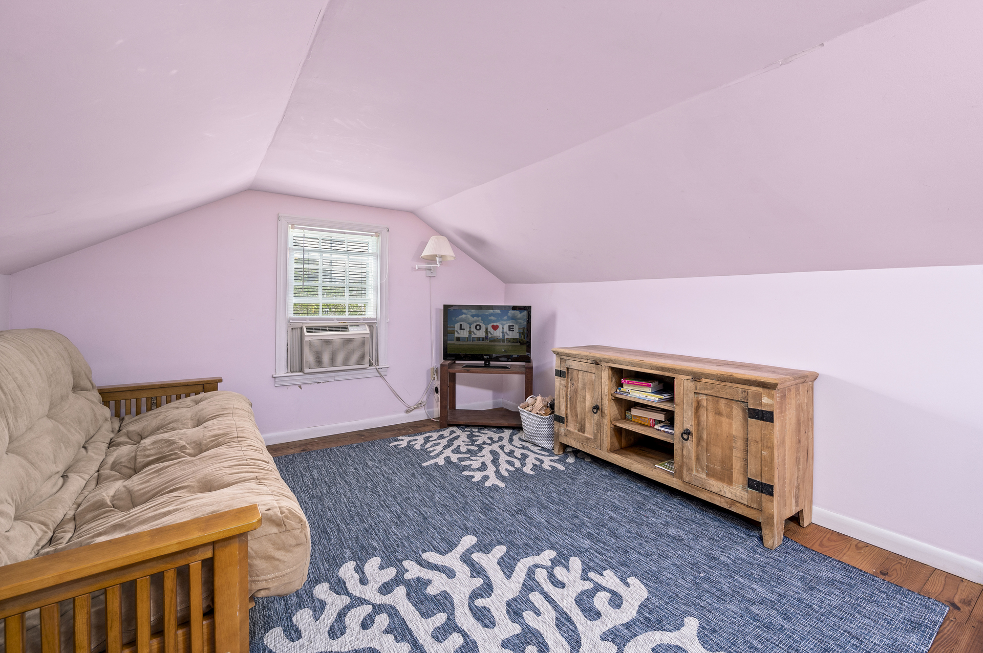 Upstairs, the Loft has a Queen Futon and Flat Screen Streaming TV.