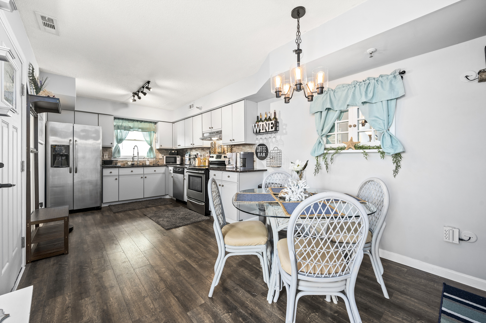 Gorgeous Beachy Floors and tasteful Coastal Decor.