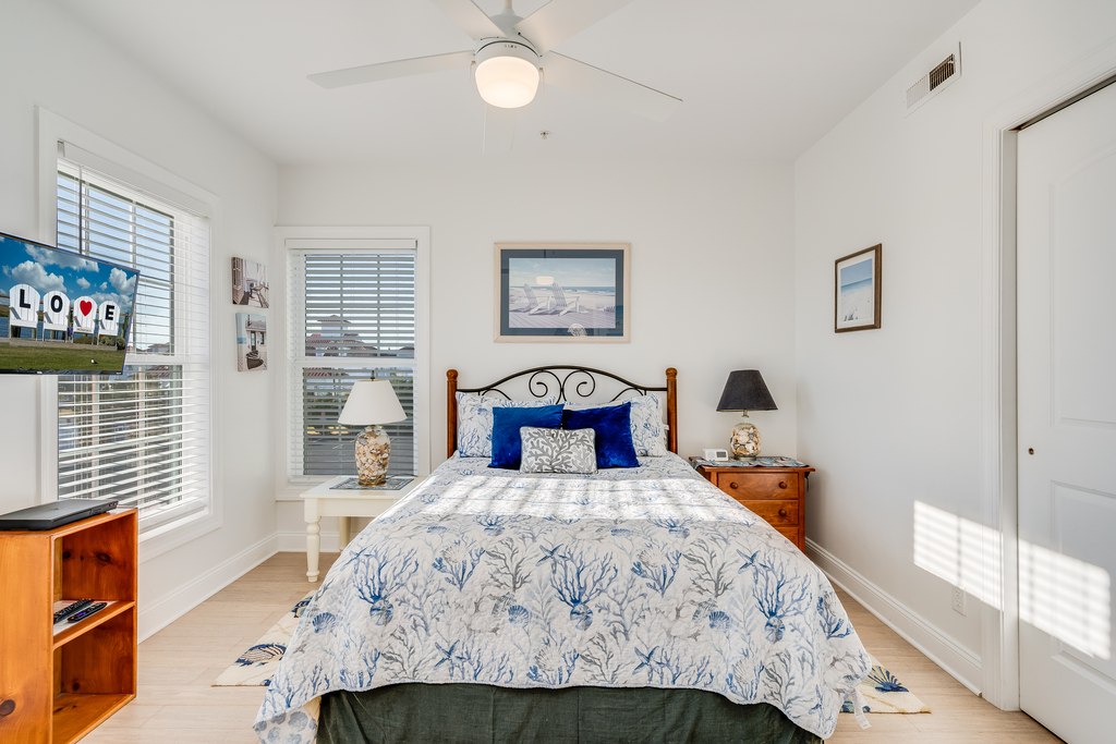 Bedroom 3 has a comfy Queen Bed and Colors of Sand & Sea.