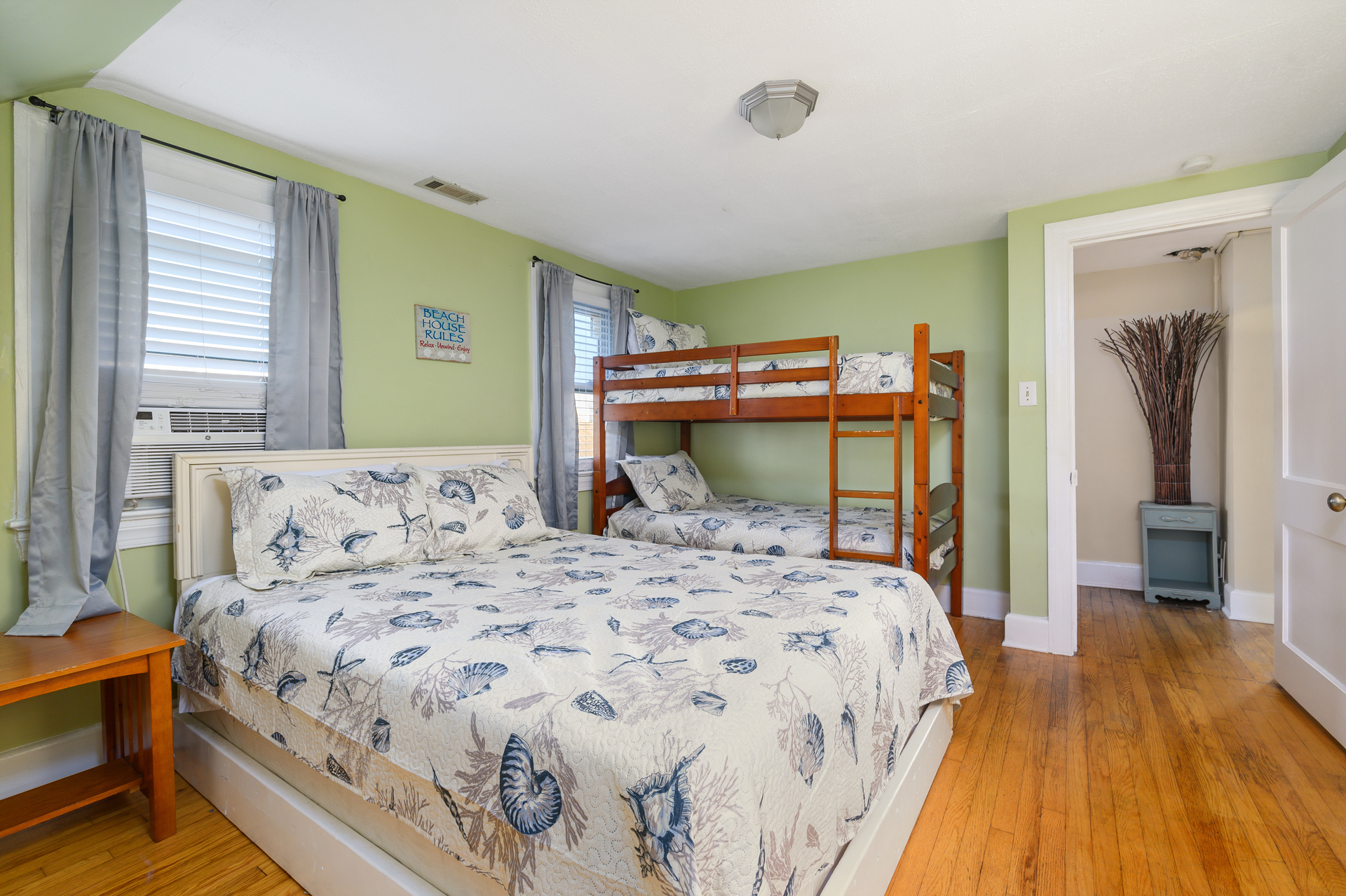 The bedroom comfortably sleeps a family of 4 with a Queen Bed and Twin Bunk