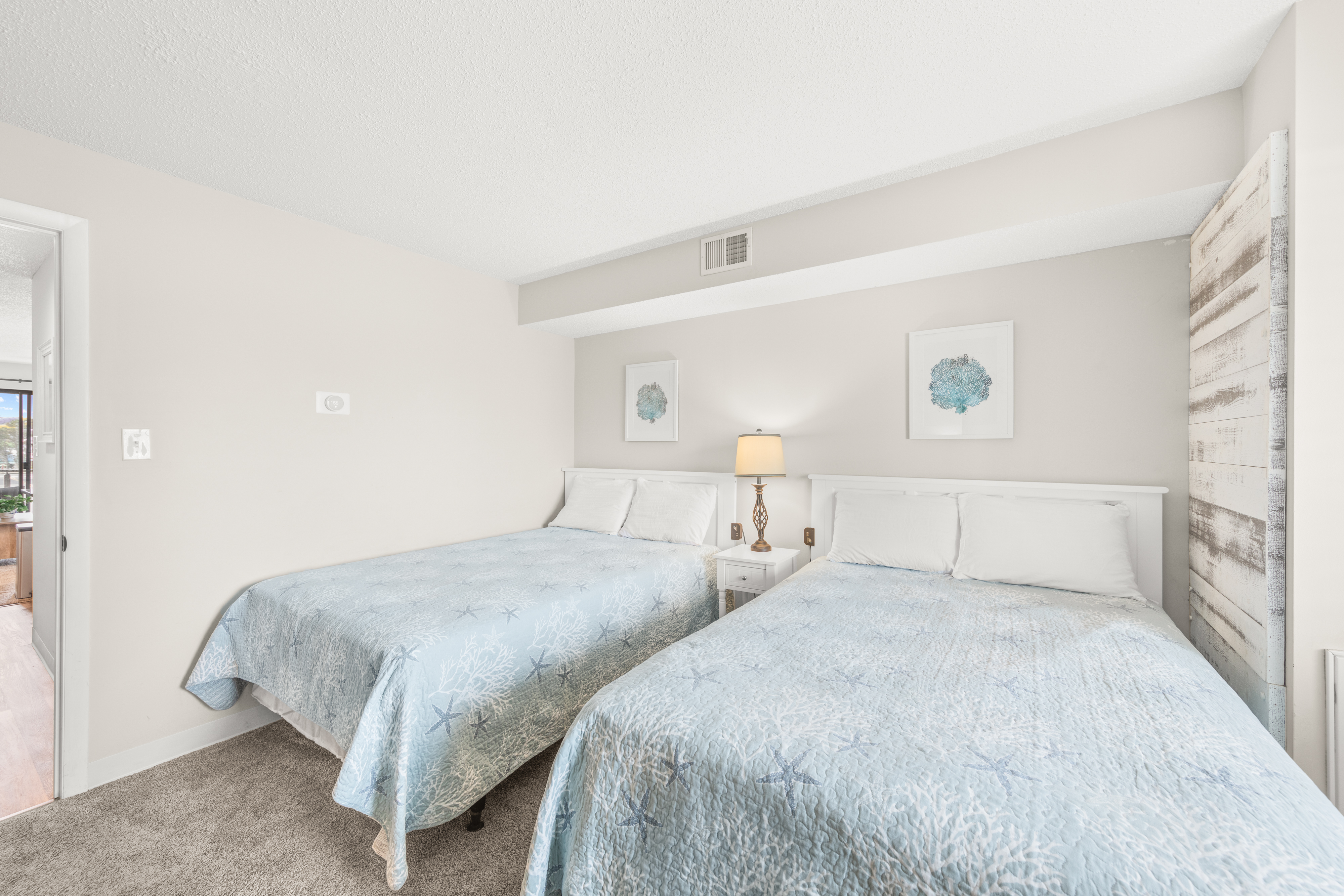 This bedroom features 2 Cozy Full Beds.