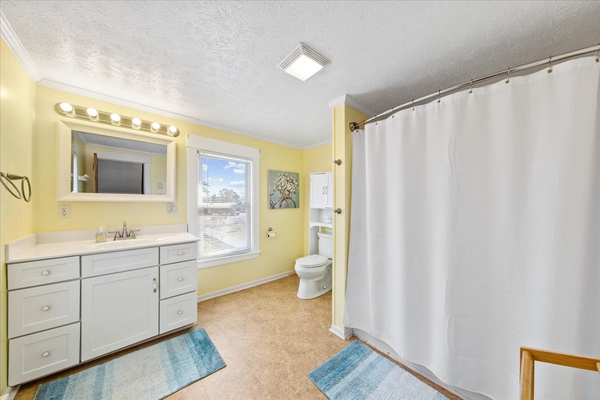 Huge Full Bath 2 is convenient to both Bedrooms and has a Tub/Shower Combo.