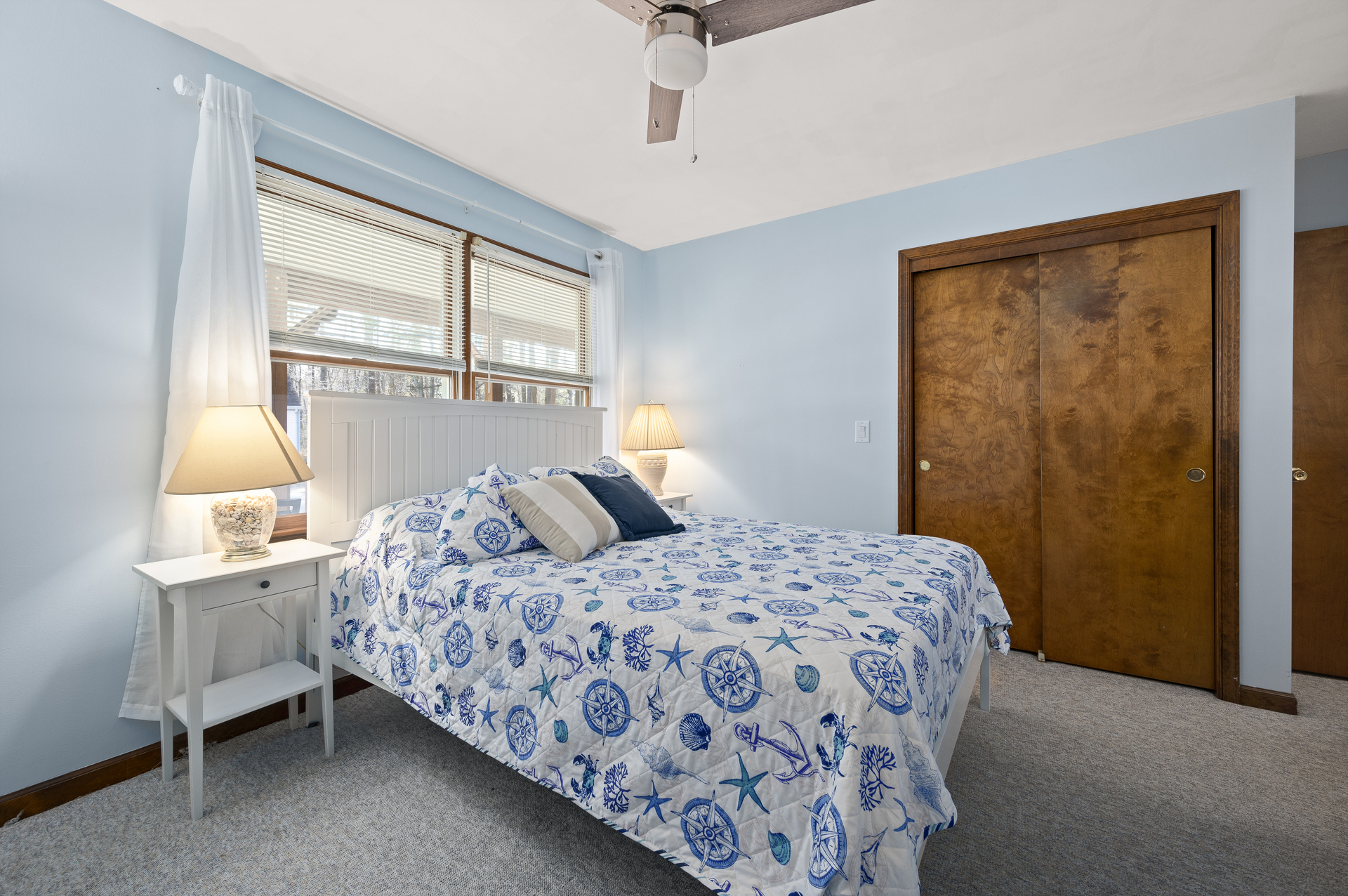 Bedroom 1 is adorned in Beachy Blues.