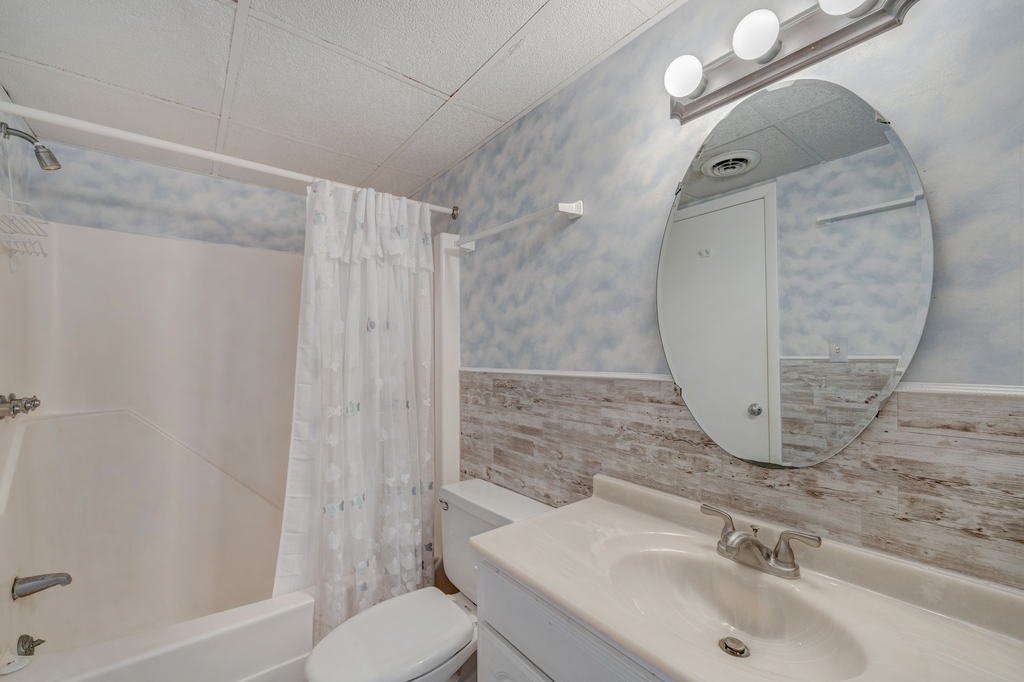 This Full Bath has a sleek shower and modern sink, with a fresh, clean feel!