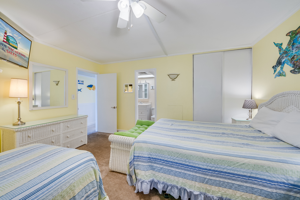 A bright, spacious room offering ample space to unpack and convenient direct access to the bathroom.